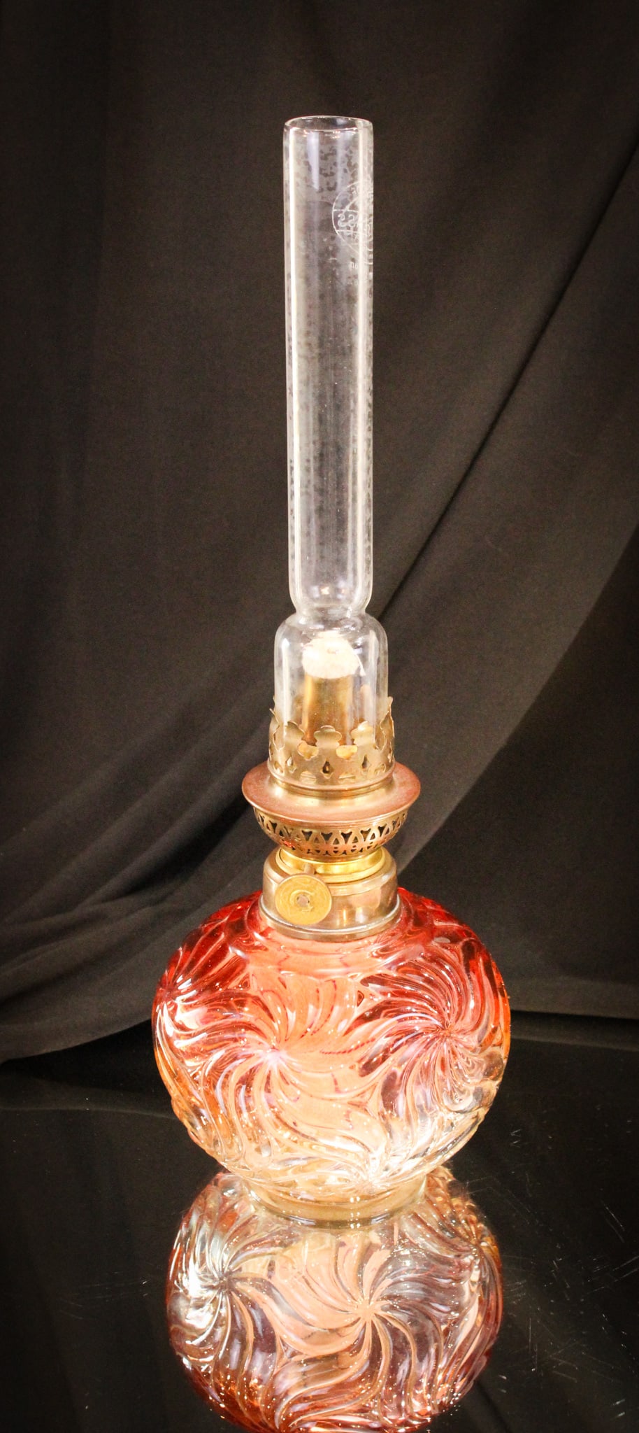 Baccarat France Rose Tiente Oil Lamp: Stunning color makes up this Baccarat Roe Tiente Swirl oil lamp. Complete with old buner and appropriate chimney. Lamp stands 13" tall to the top of the chimney, 7" tall to the top of the burner, and 