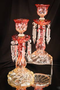 Pr. 13" Baccarat France Rose Tiente Glass Candlesticks: Striking pair of Baccarat Rose Tiente Glass Candlesticks complete with prisms. Perfectly matched pair. Excellent coloring. Each measures 12 1/2" tall.