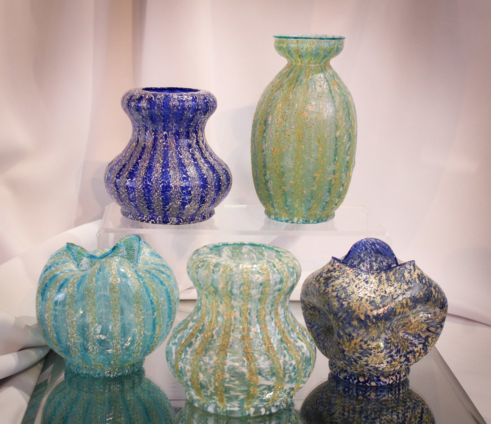 5 pc Lot Dugan Pompeiian/Venetian Frit Glass: Five selections in shades of blue make up this choice lot of Dugan frit glass. Largest measures 6 1/4".