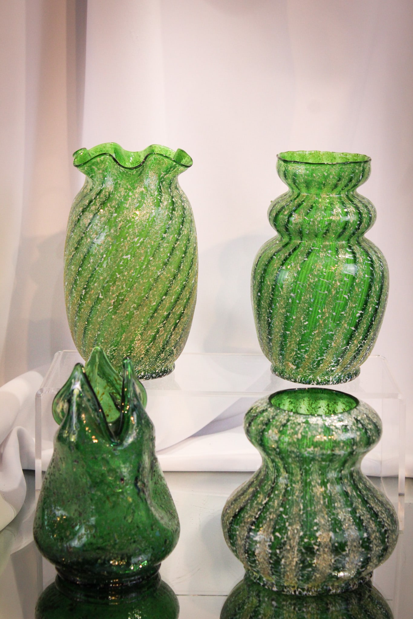 4 pc Lot Dugan Pompeiian/Venetian Frit Glass: Rich dark green examples of Dugan frit glass make up this lot with four selections. Tallest measures 6".