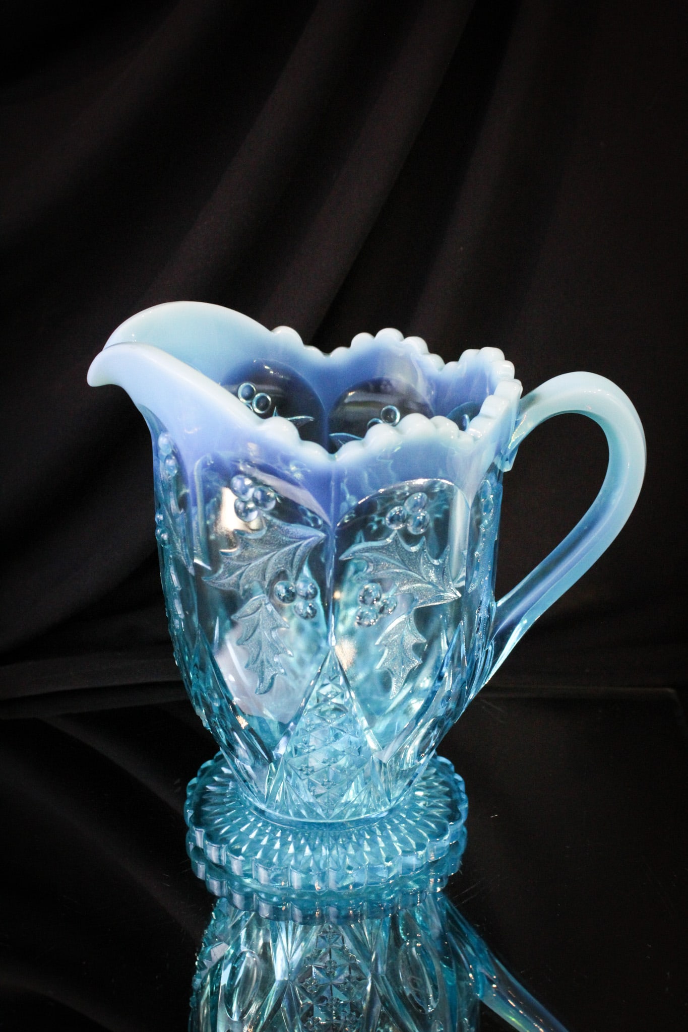 Northwood Blue Opalescent Holly Water Pitcher: Brilliant blue opalescent example of the fan favorite pattern Panelled Holly by Northwood. This one with strong opal.
