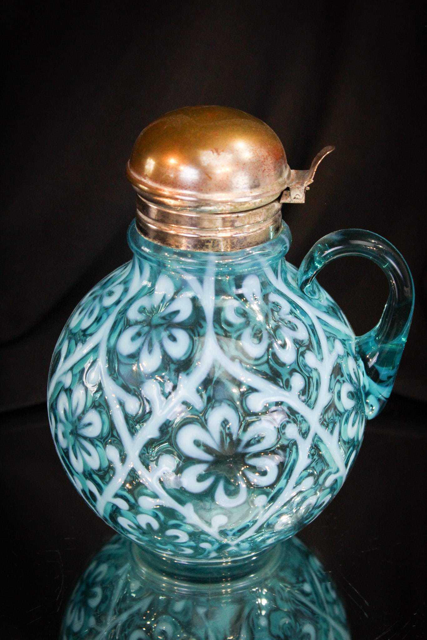 Northwood Blue Opalescent Daisy in Criss Cross Victorian Syrup Pitcher: Great opalescene and vivid blue color makes this a stand out piece in our auction. A beautiful Northwood syrup.
