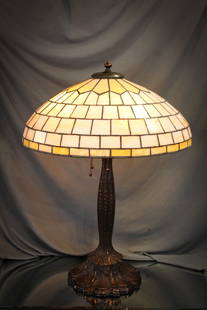 Duffner & Kimberly Leaded Glass Table Lamp: Beautiful Duffner & Kimberly leaded glass table lamp. Shade features geometric design in caramel colors. Ornate base with great detail. Approximately 18.5" in diameter.