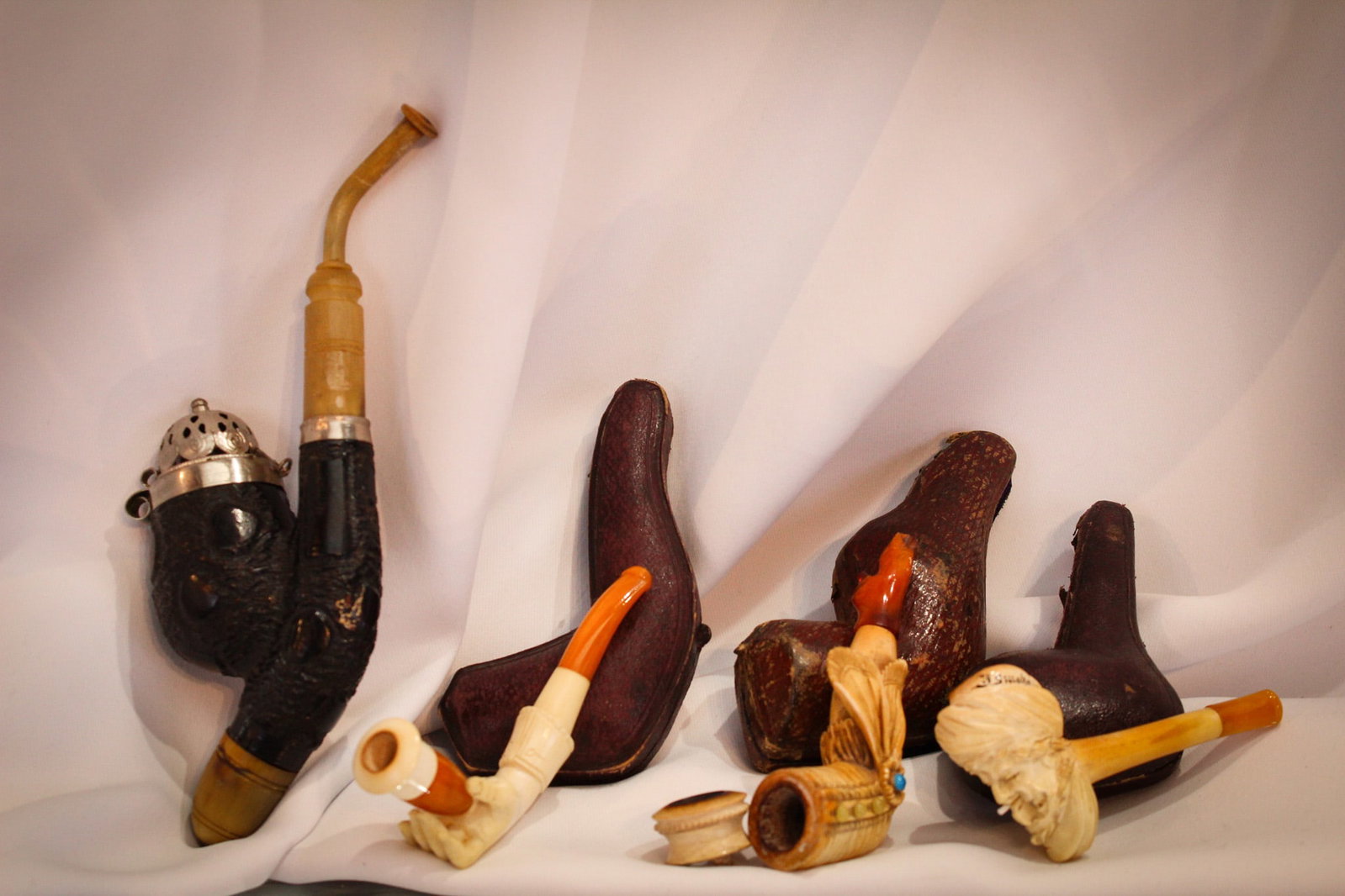 4 pc Lot Victorian Novelty Bone Smoking Pipes Ladies Hand & Leg Arabian & More: Select offering of four antique Victorian novelty smoking pipes in the form of a ladies leg, a ladies hand, an Arabian man, and more. Made of wood, bone, silver and more. Longest measures 7".