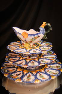 Henriot Quimper Pottery 3 Tier Oyster Plate Service Set: Great Henriot Quimper pottery three tier oyster service set complete with mignonette server. The four pieces all have the original retailer tags. Measures 10 3/4 tall, 13" diameter.