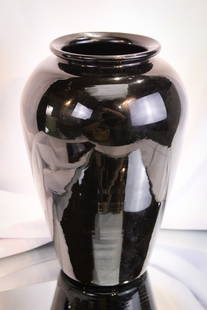 Steuben Mirror Black Glass Vase: Striking Mirror Black marked with Fleur De Lis mark, Steuben glass vase. Measures 8 1/4".