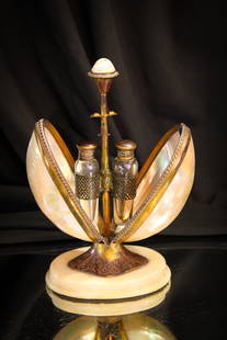 Rare Mechanical Shell Mother of Pearl Antique Perfume: Rare find here in this antique Shell Mother of Pearl mechanical perfume castor complete with the original bottles. Base is marble. Very nice item. Stands 7" tall to the top of the finial