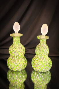 Pair Italian Millefiori Art Glass Perfume Bottles: Two little gems in Italian Millefiori glass make up this offering. Each matching in green color. Complete with original stoppers.