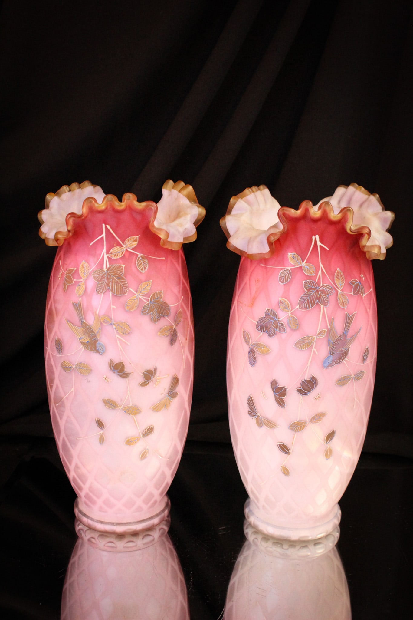 Pair 9" Diamond Quilt Mother of Pearl Decorated Vases: Great find here in this pair of matching decoration Victorian glass vases. Each expertly enameled with birds, butterflies, and foliage. Each measures 9 1/2" tall.