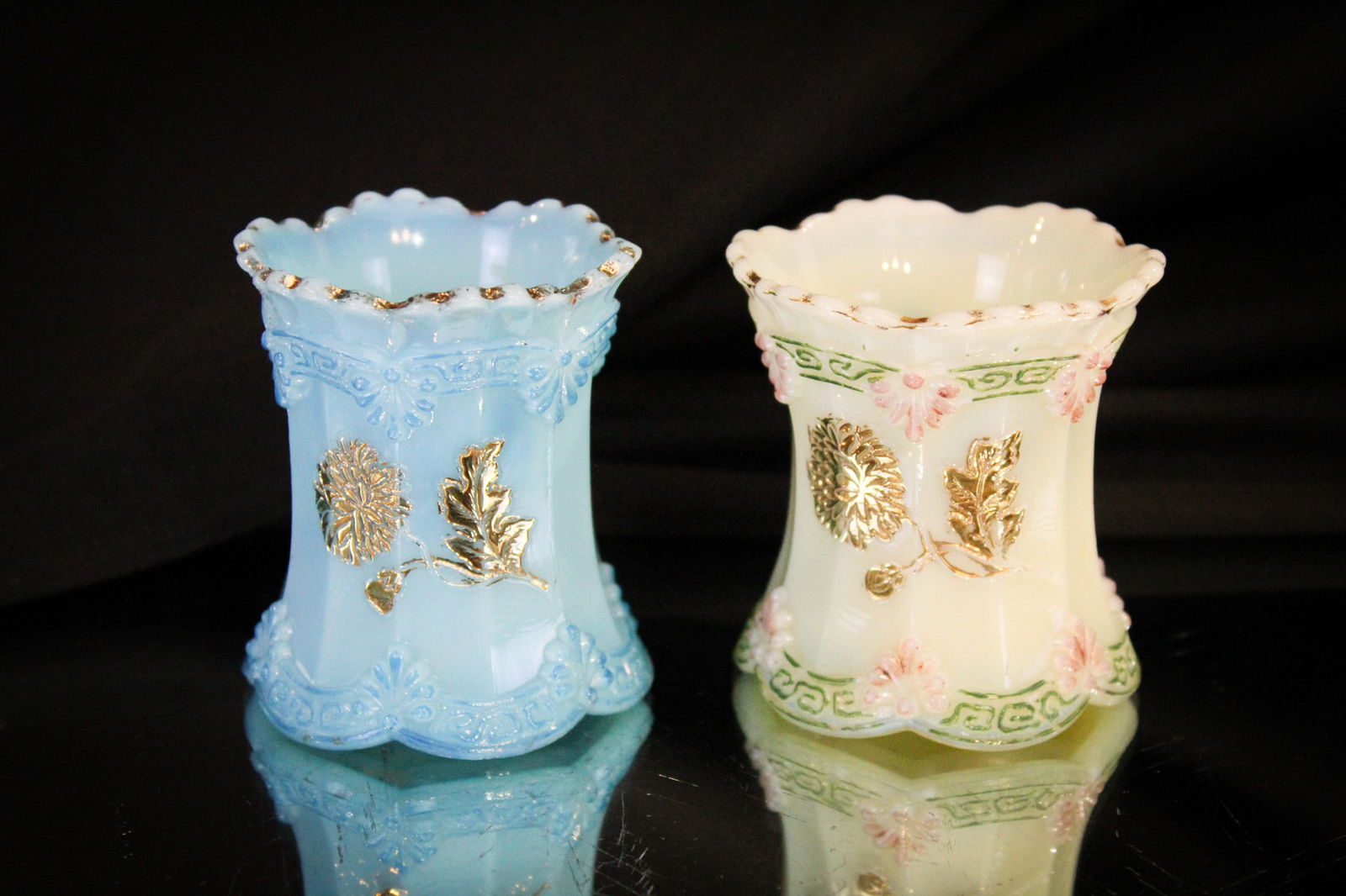 2 pc Lot Northwood Custard Glass Victorian Toothpick Holders: Two examples of the Northwood Chrysanthemum Sprig pattern in ivory and blue custard glass. Each decorated. Each measures 2 3/4".