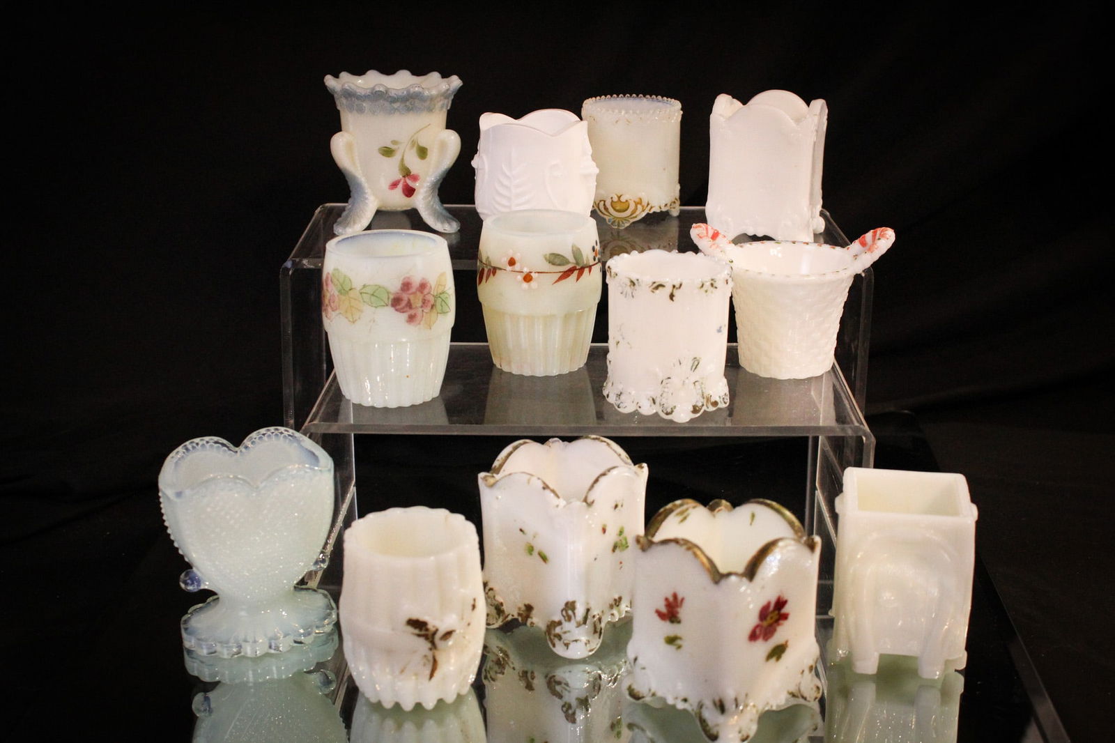 13 pc Lot Milk Glass Victorian & More Toothpick Holders: Nice selection of some genuine finds here folks! Lot is comprised of 13 examples in milk glass. One contemporary example included. Tallest measures 2 1/2".