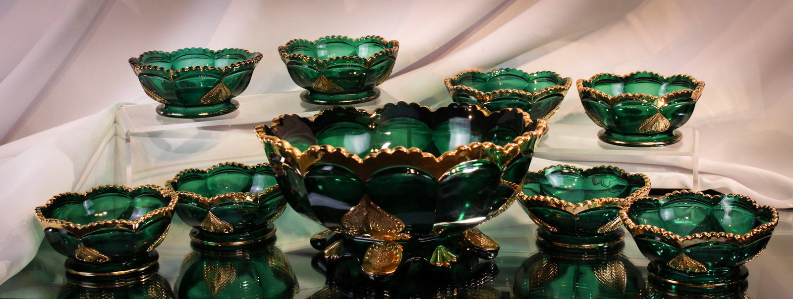 9pc Northwood Regent Leaf Medallion Victorian Glass Berry Set: Superior example of a Northwood Victorian glass green with gilt decoration nine piece berry set in the Regent or Leaf Medallion pattern. Great offering. Largest piece measures 4 1/4" tall, 8" diameter