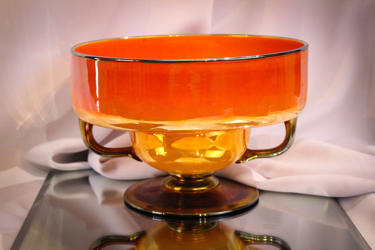 Imperial Freehand Lead Lustre Art Glass Centerpiece Bowl: This piece from the private collection of Ernest L. Albanese Jr. Amazing Imperial freehand lead lustre art glass centerpiece bowl with handles and pedestal base. This piece in orange irridescent is ov