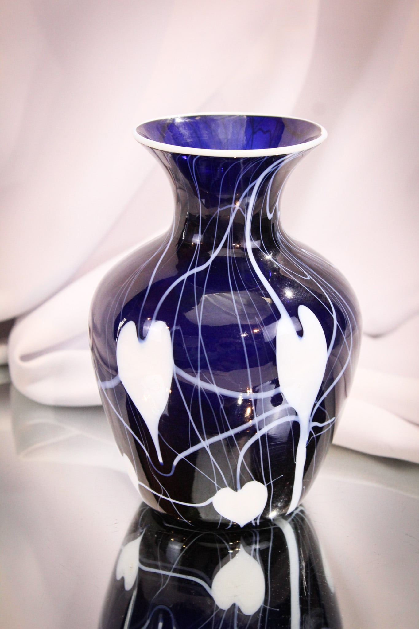 Imperial Freehand Lead Lustre Cobalt Heart & Vine Art Glass Vase: This piece from the private collection of Ernest L. Albanese Jr. Great example of Imperial lead lustre freehand art glass. This cobalt vase has white Heart & Vine decoration. Measures 6 1/4".