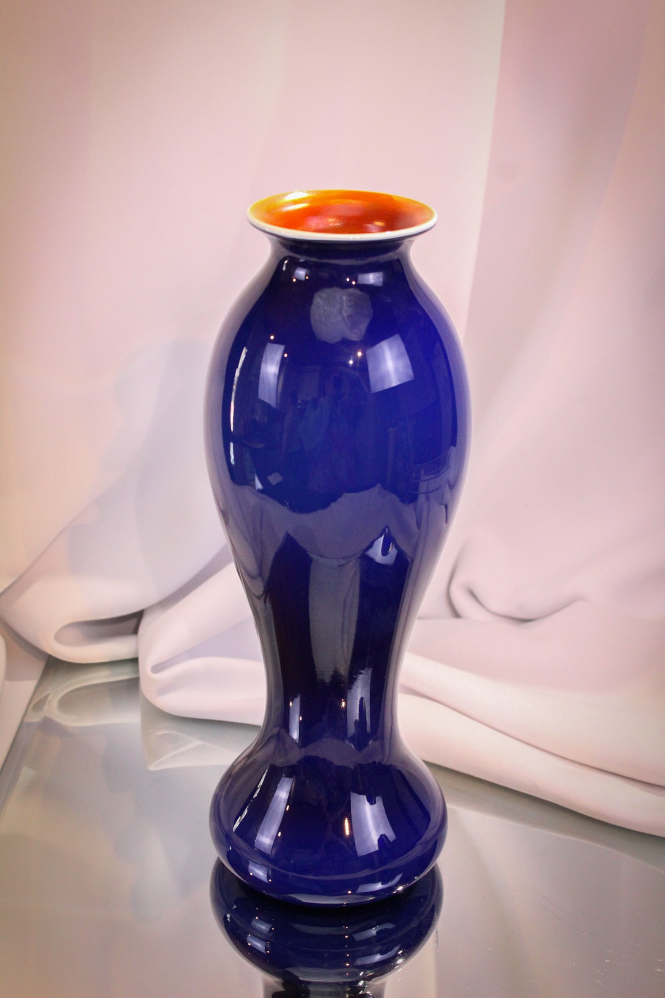 Imperial Freehand Lead Lustre Blue & Orange Art Glass Vase: This piece from the private collection of Ernest L. Albanese Jr. Great piece of Imperial art glass. This a cobalt and orange freehand lead lustre vase. Vase stands 10 3/4" tall.