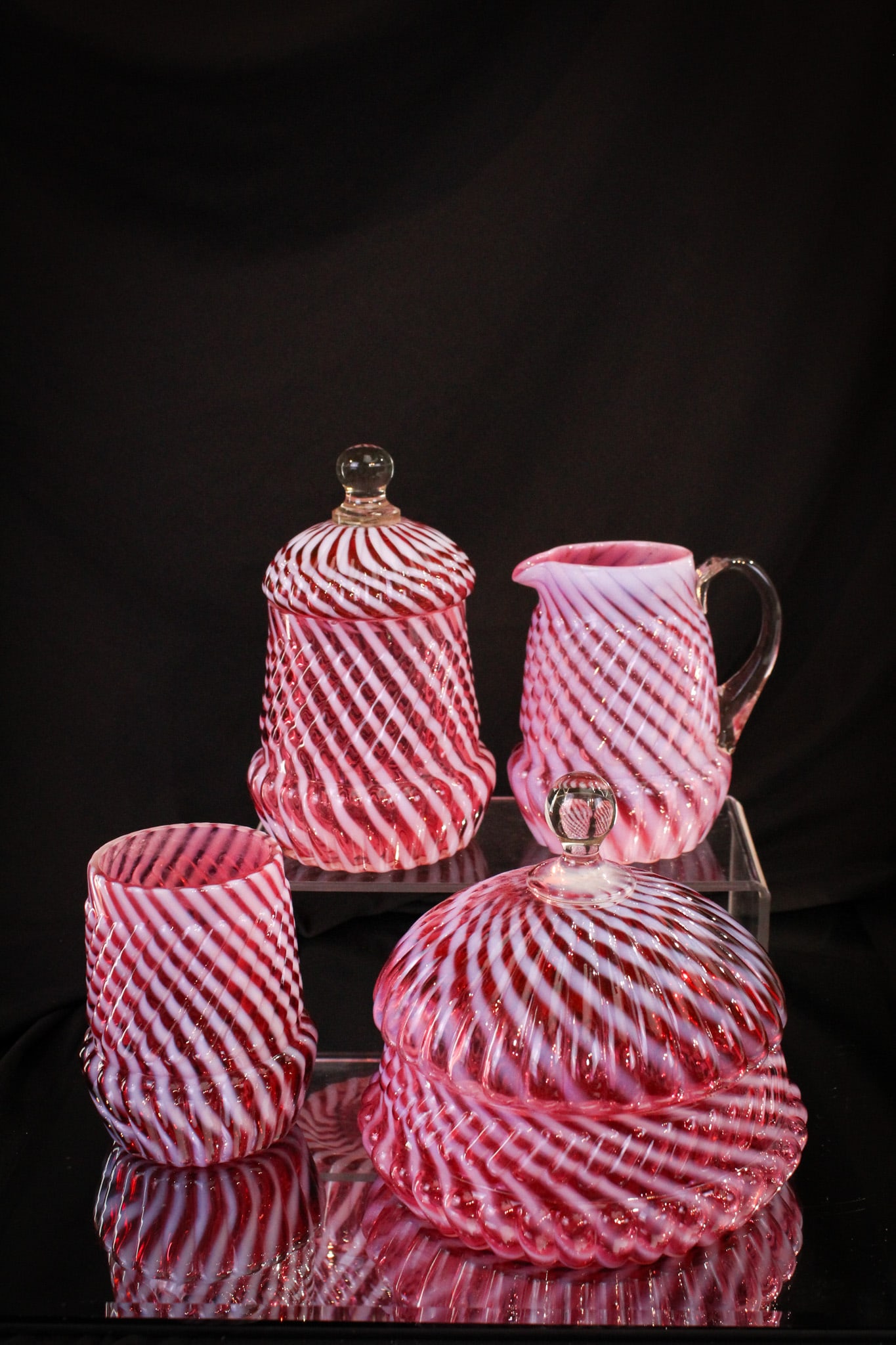 Northwood Cranberry Opalescent Chrysanthemum Swirl Table Set: One outstanding set as far as color and well matched opalescence. So hard to find complete. We are please to offer this beauty of a Northwood Chrysanthemum Base Swirl pattern complete table set.