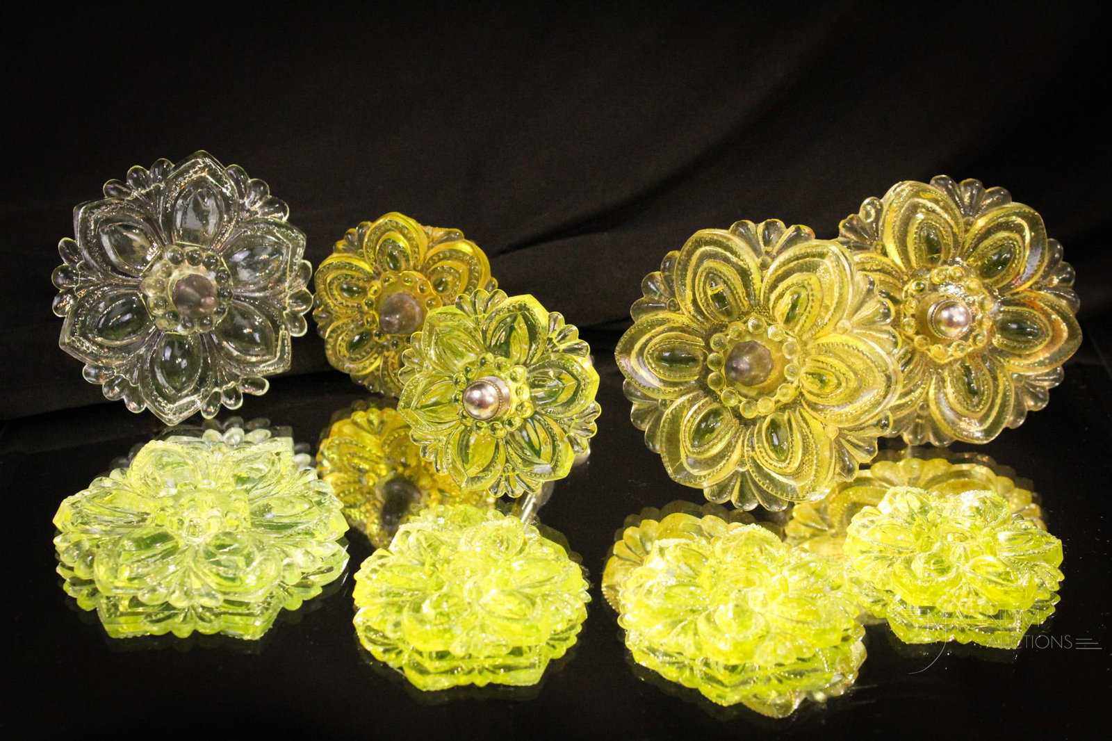 9 pc Lot Vaseline Glass Curtain Tie Backs: Nice assortment of vaseline pressed glass curtain tie backs in various sizes. Four examples are 3" diameter. Five are 2 1/4" in diameter Three of the small are missing the hardware. One large is missi