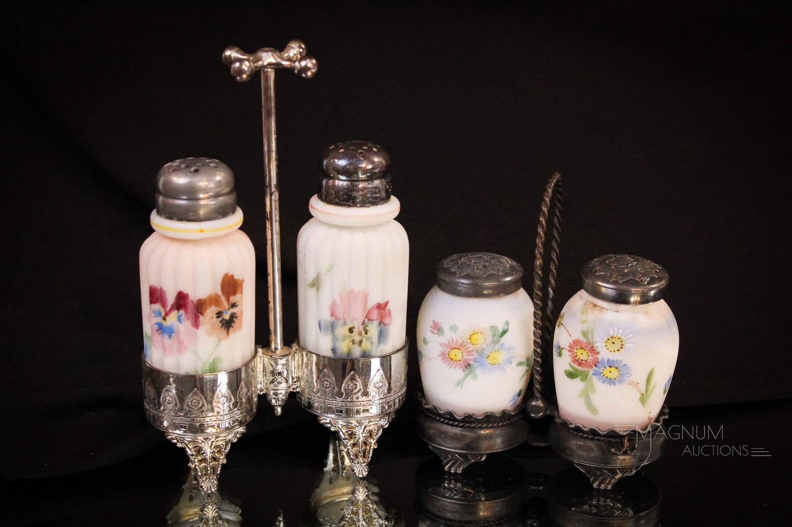 2 pc Lot Mt. Washington Victorian Glass Shakers Sets in Silverplate: Two wonderfully collectible Mt. Washington Victorian Glass and silverplate shaker set. Pillar mold in signed Barbour silverplate frame. The barrels in a signed Pairpoint frame. Tallest measures 6 1/2"