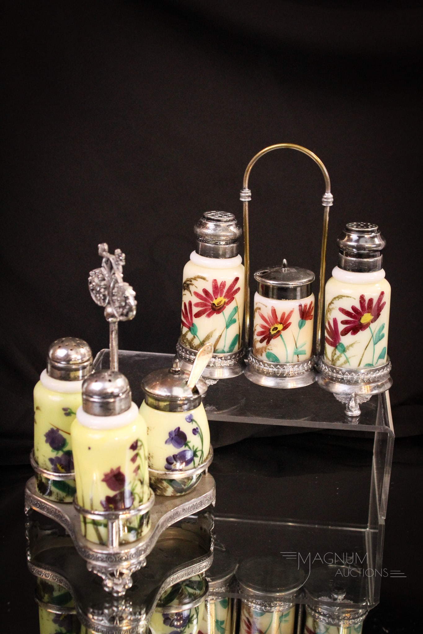 2 pc Lot Victorian Glass & Silverplate Shaker Condiment Sets: Nice examples of Victorian decorated opal glass shaker condiment sets residing in signed silverplate holders. One signed St. Louis and the other signed Wilcox silverplate.