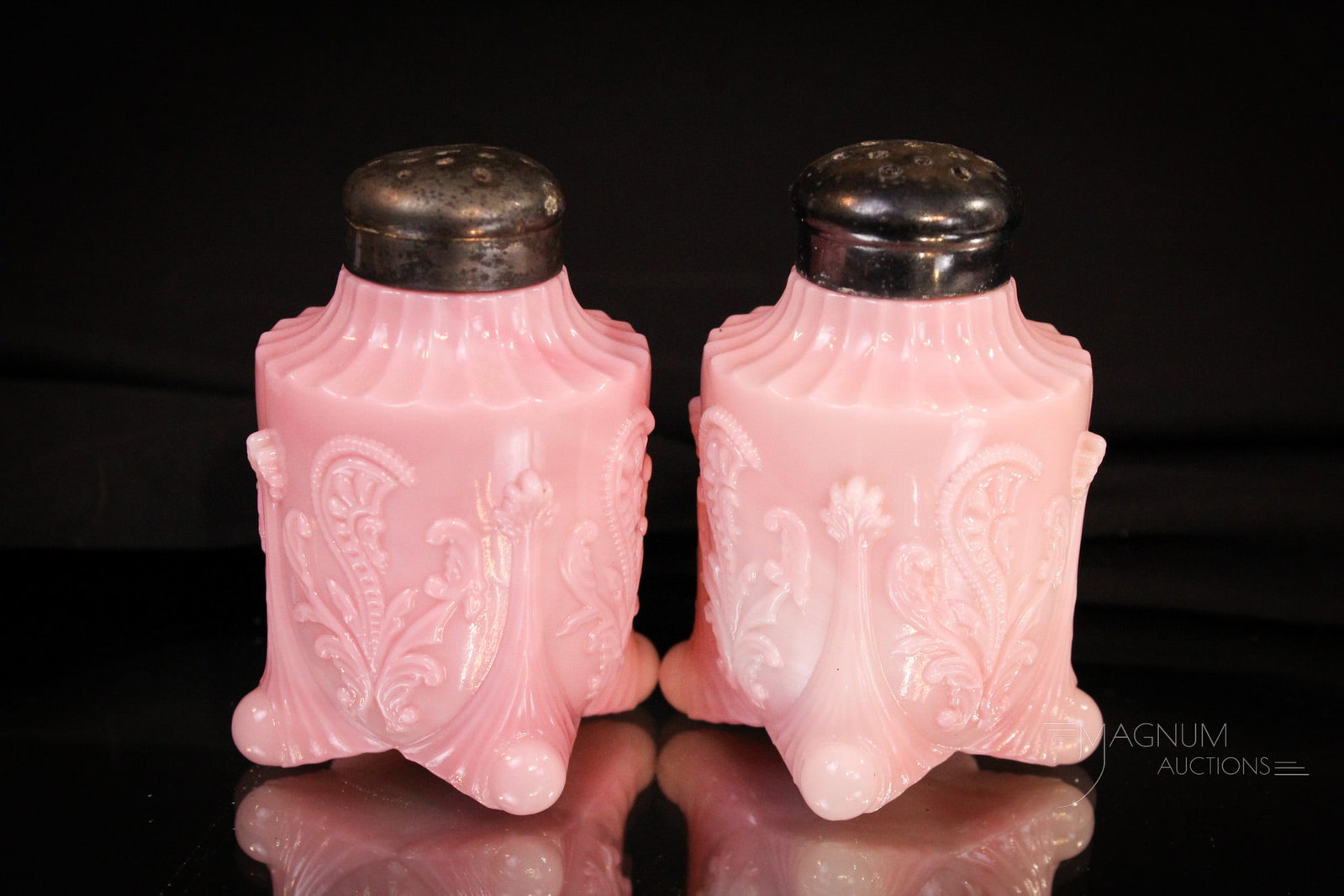 Pair Northwood Pink Slag Inverted Fan & Feather Shakers: Great offering of a pair of pink slag Victorian Northwood salt shakers in the Inverted Fan & Feather pattern. Good coloring to each. Tough to find pattern. Each measures 3 1/4" tall.