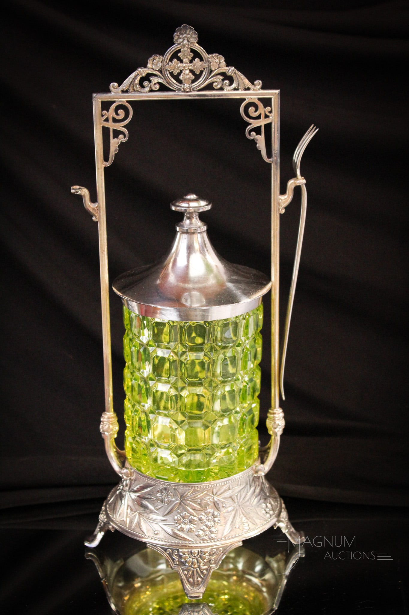 Simpson Miller Victorian Silverplate Vaseline Block Pickle Castor: Beautiful offering here, folks. This a signed Simpson, Hall, and Miller Victorian frame complete with vaseline block pickle jar insert. Measures 12 1/2" tall.