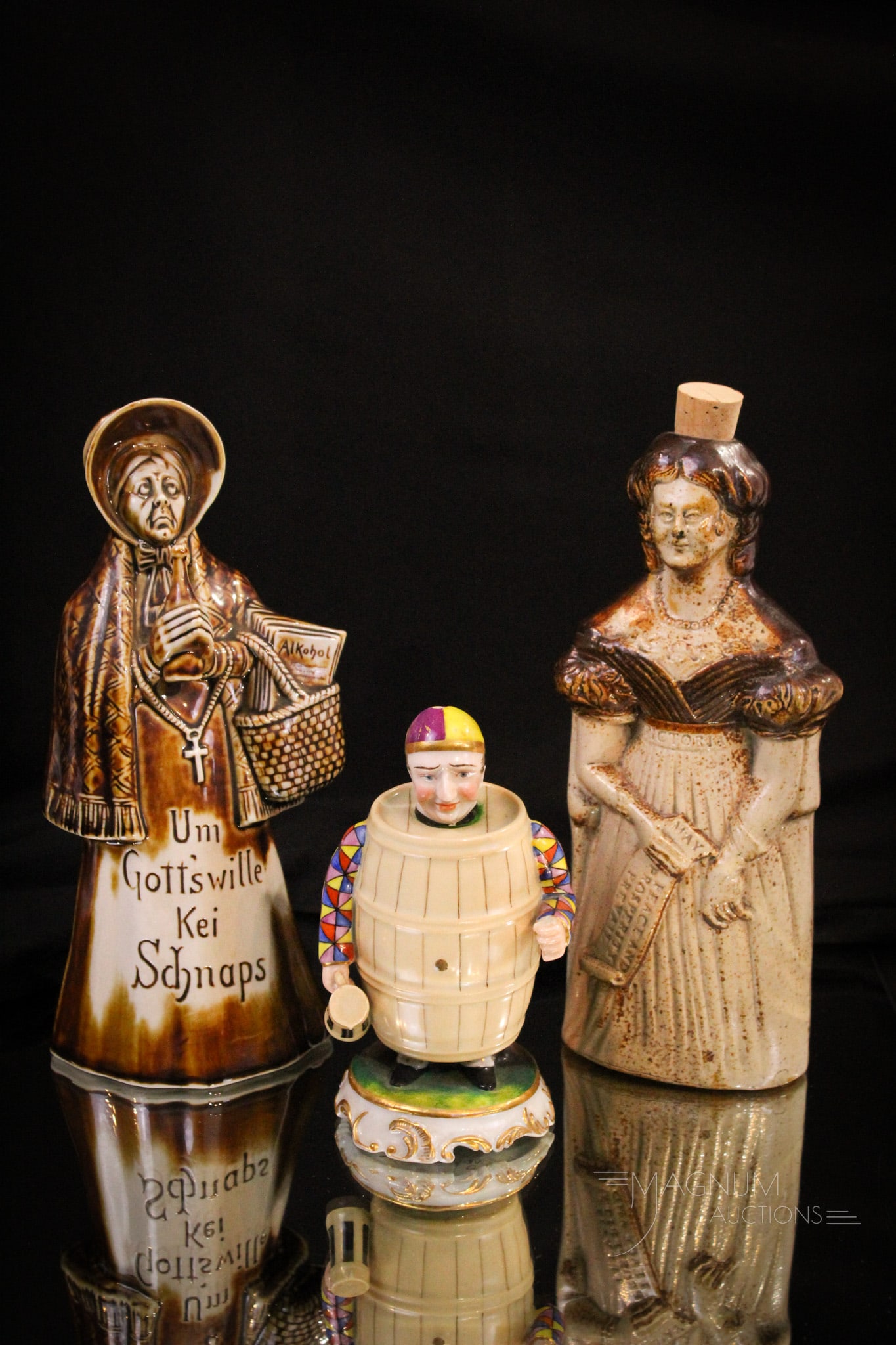 3 pc Lot Pottery & Porcelain Flasks: Three piece lot of pottery and porcelain flasks. The first, a pottery flask of Queen Victoria. The second, a porcelain elderly woman flask for schnaps. Both of these are offered along with a porcelain