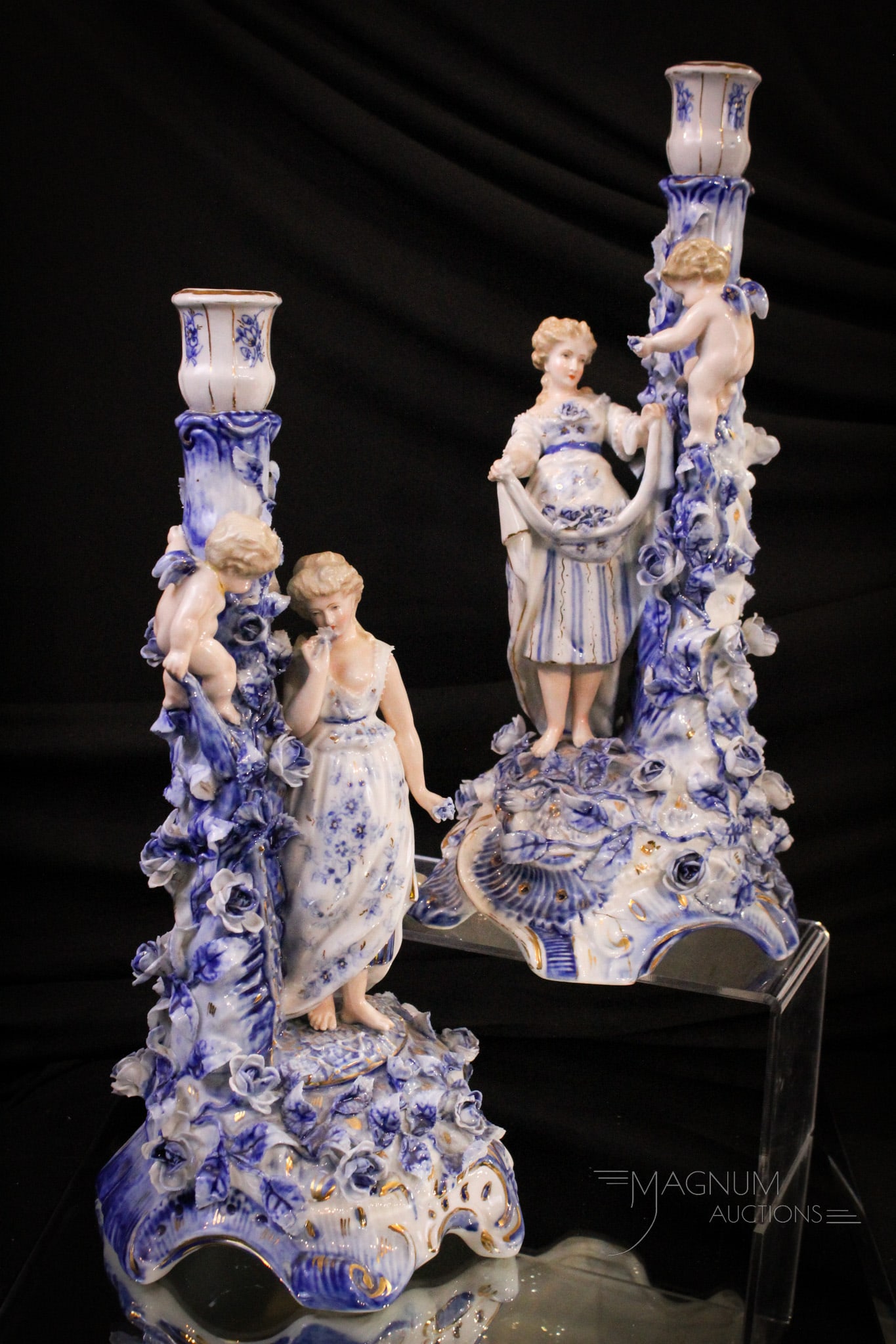 Pair of German Porcelain Figural 14 1/2" Candlesticks: Fantastic pair of German porcelain figural candlesticks with applied decorative elements. Each measures 14 1/2" tall.