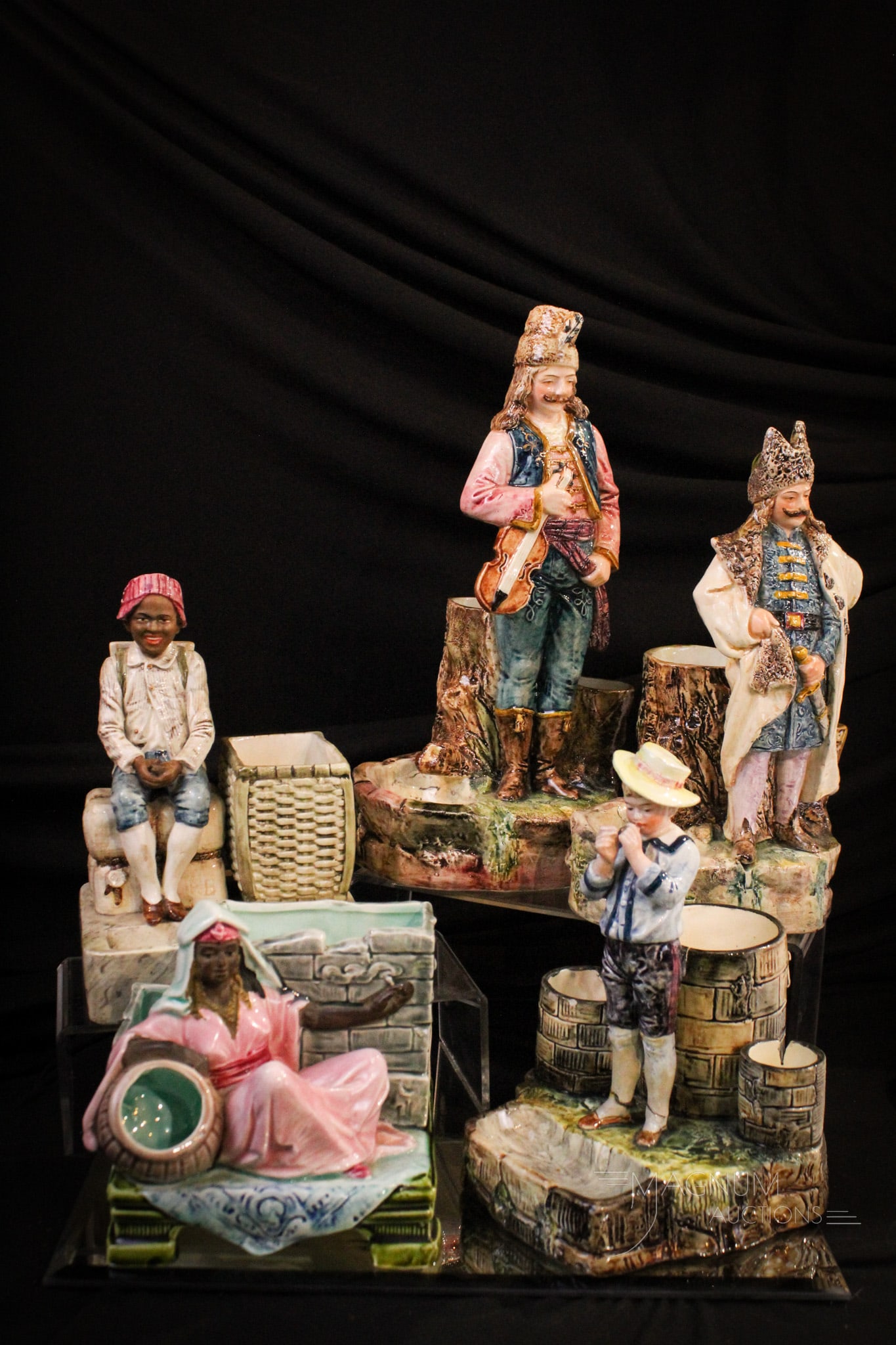 5 pc Lot Figural Majolica Smoking Sets: Five unique examples of Victorian Majolica smoking sets each with figures Largest measures 12" tall.