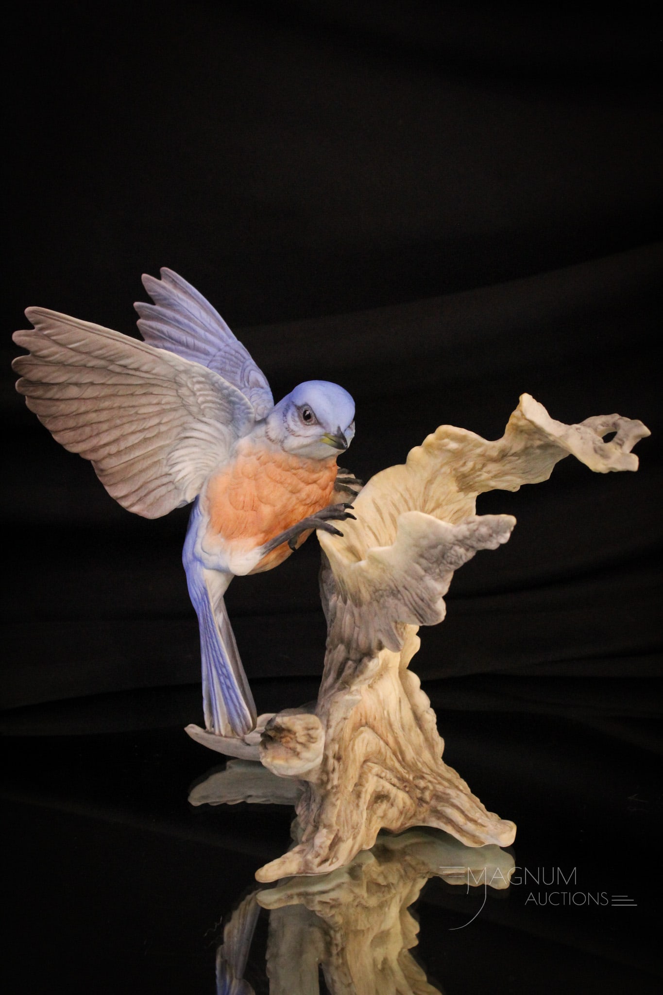Boehm Blue Bird Figurine: Beautiful signed Boehm bisque porcelain blue bird figurine. Measures 8" tall, 8 1/2" wide.