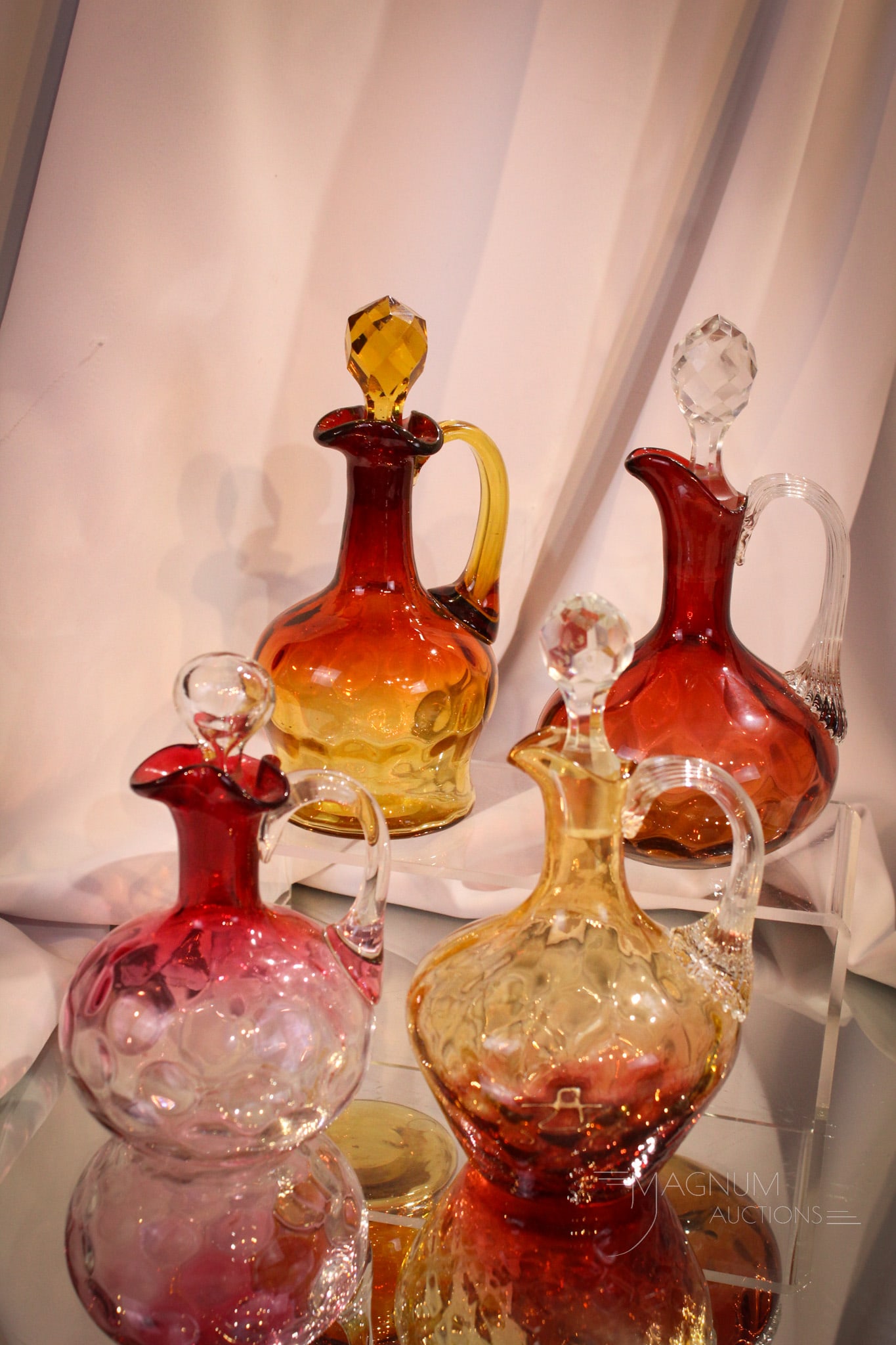4 pc Lot Victorian Amberina Phoenix Mt. Washington & More Cruets: Four fine examples of Victorian cruets: Three are in amberina, one is in rubina. Examples include an amberina Mt. Washington Winchester example, two Phoenix examples, and a Hobb's Rubina. Tallest meas
