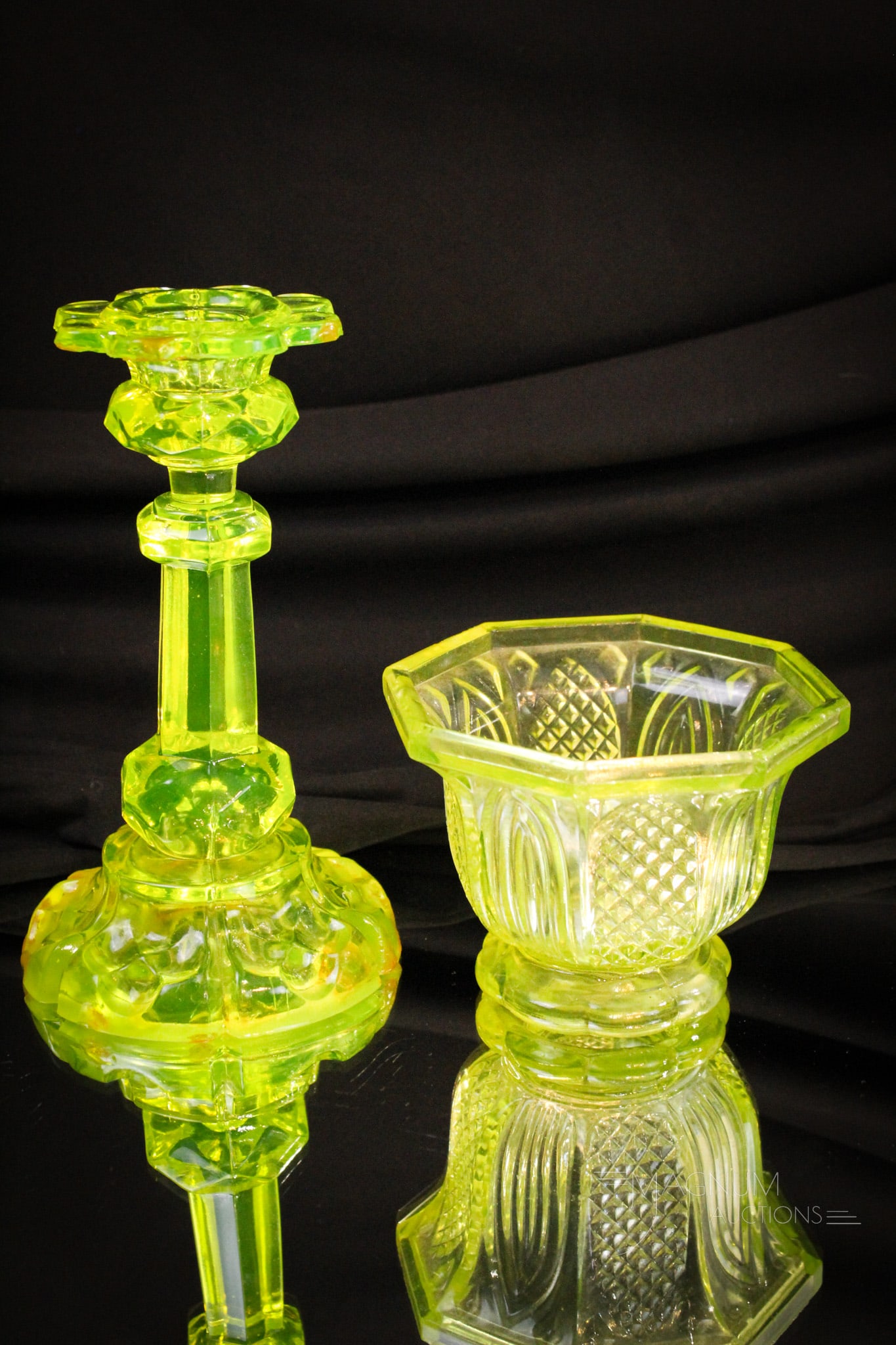 2 pc Lot Vaseline Flint Glass: Two pieces of Vaseline flint glass. An open sugar in the Gothic Arches pattern along with a candlestick.