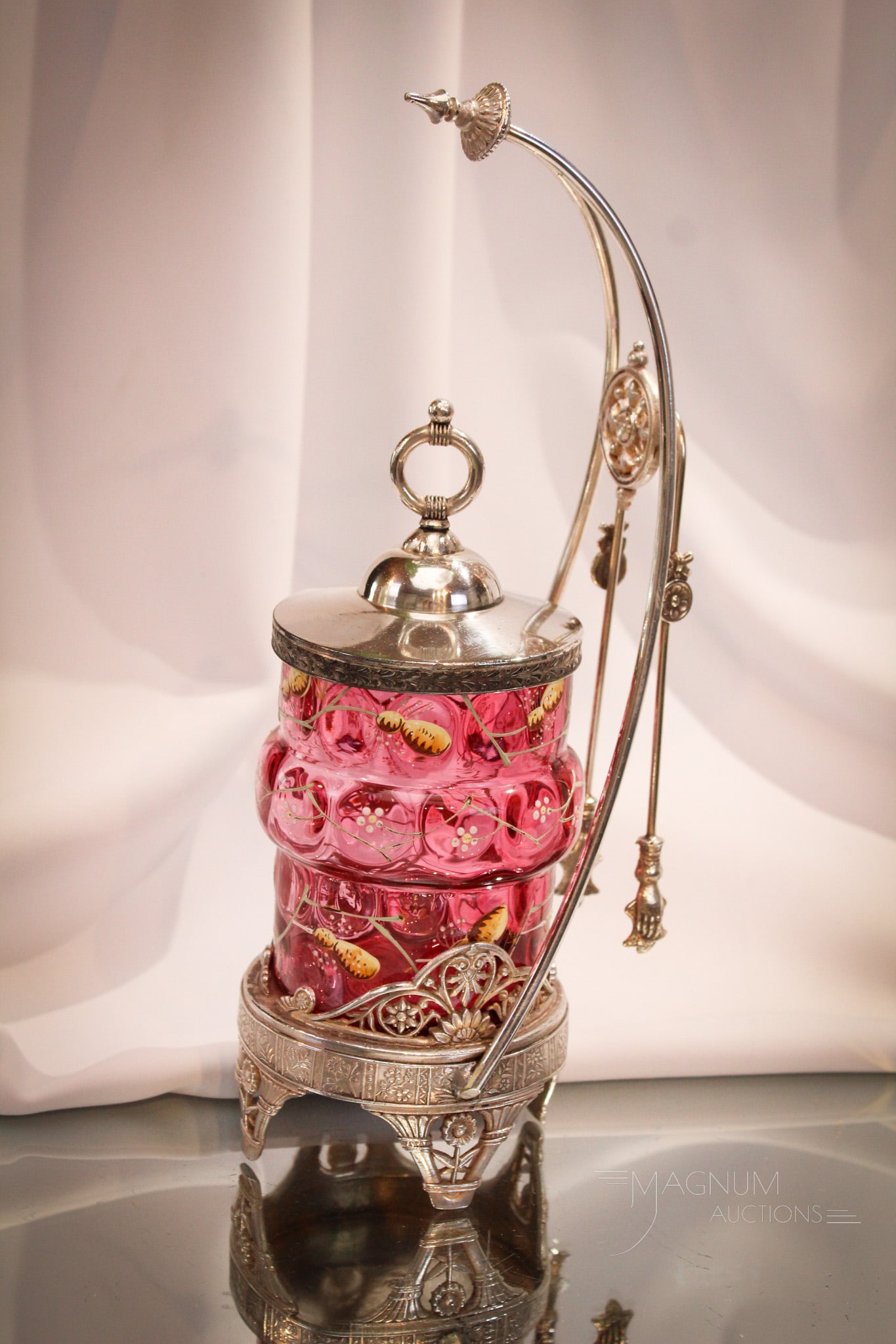 Tufts Victorian Silverplate Enameled Glass Pickle Castor: Fabulous Victorian Tufts silverplate cranberry enameled pickle castor. Piece is complete with original lid that hangs on the frame. Cranberry jar is elaborately decorated with peanut flowers. Complete