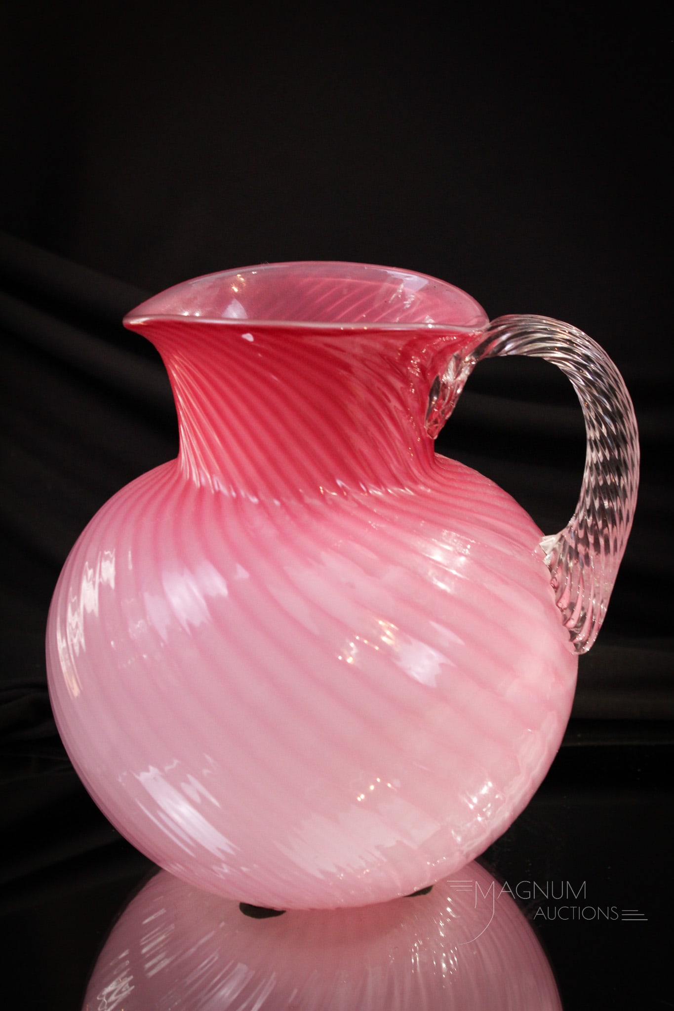 Hobb's Cased Victorian Glass Neopolitan Victorian Pitcher: Pretty in pink example of a Hobb's Victortian glass Neopolitan water pitcher. Beautiful piece with rope twisted handle. Gorgeous coloring. It stands tall at 7 1/2".