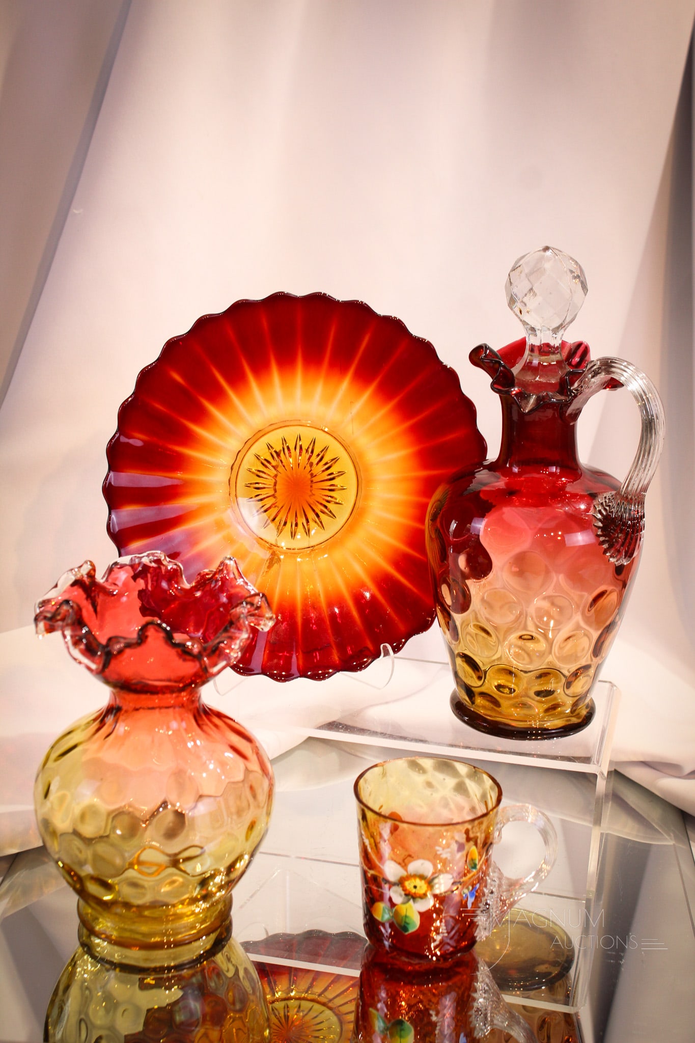 4 pc Lot Victorian & More Amberina Glass: Four fine amberina glass lovelies to enhance your curio cabinet: A tall claret with faceted stopper. An enameled diamond quilt custard cup. A Ribbed for your pleasure plate. Lot is completed by a ruff