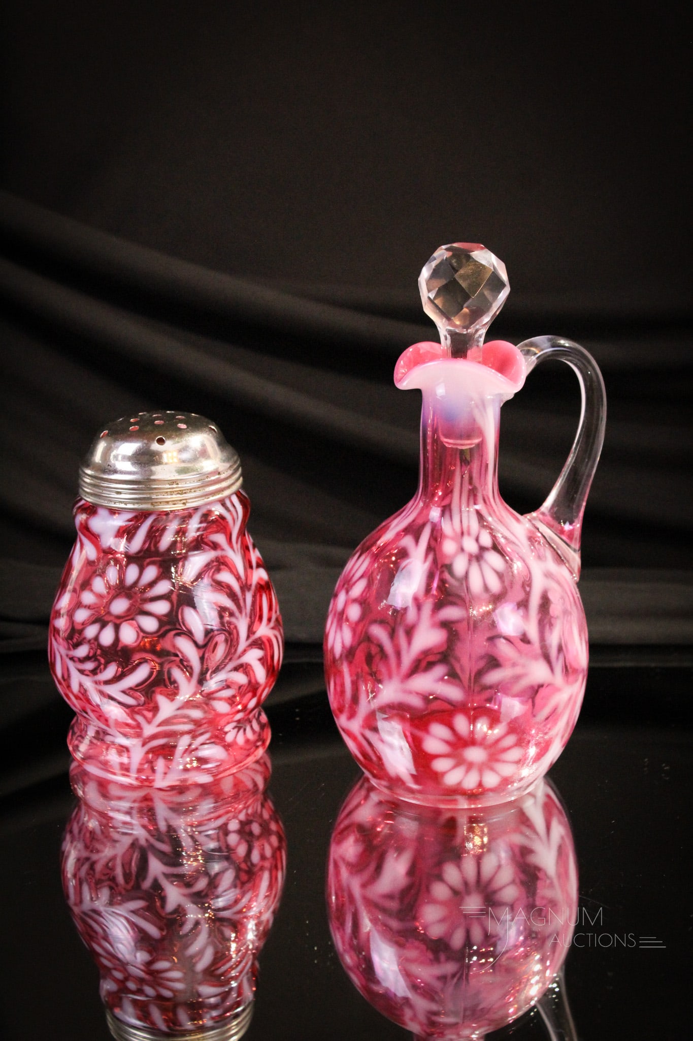 2 pc Lot Northwood Cranberry Opalescent Cruet & Sugar Shaker: Two super examples of cranberry opalescent Northwood Daisy & Fern pattern. We're offering a sugar shaker in the wide waist form along with a cruet in the Indiana mold. Tallest measures 7".
