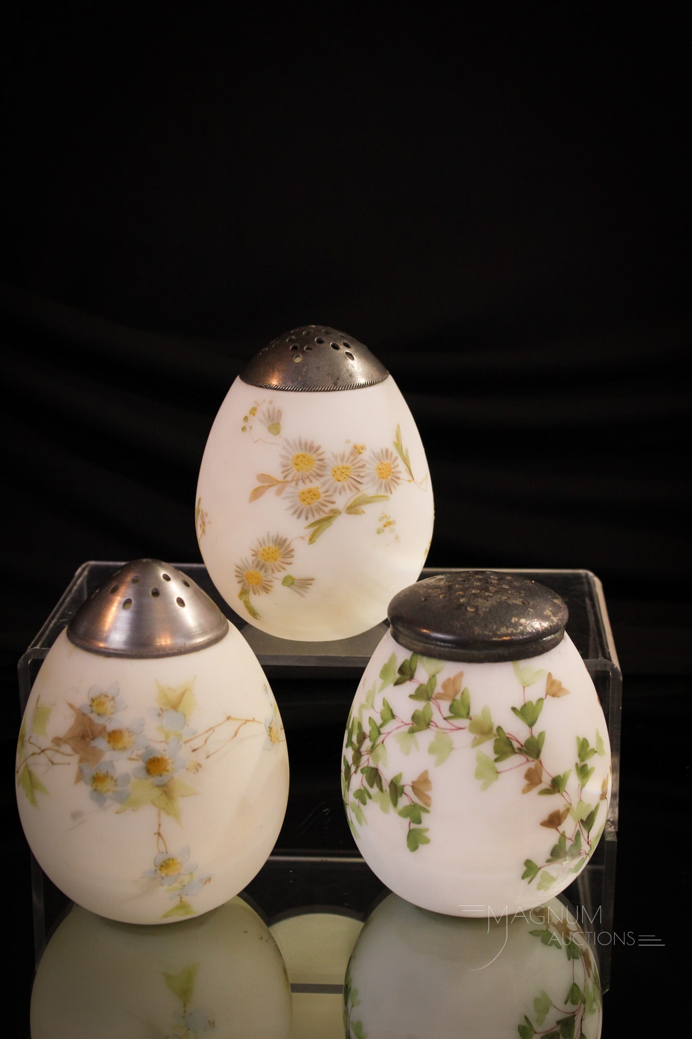 3 pc Lot Happy Family Mt. Washington Egg Sugar Shakers: Three desirable and definitely different Mt. Washington Victorian sugar shakers in the form of eggs. Each as pretty as the next. Tallest measrues 4 1/2".