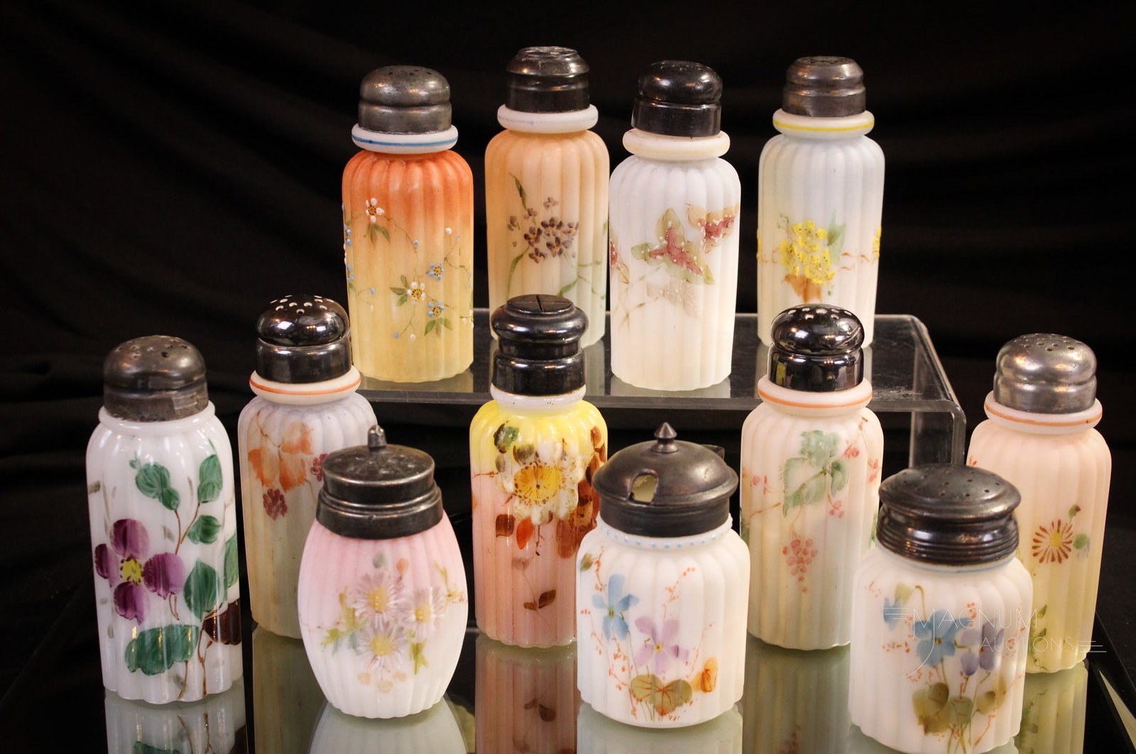 12 pc Lot Mt. Washington Pillar Mold Victorian Salt Shakers & More: Twelve select decorations and forms of Mt. Washington shakers. Nine are Pillar Mold. Two are Shorter examples with one being a barrel form and the other a mustard. The last is a short pillar mold. Tal
