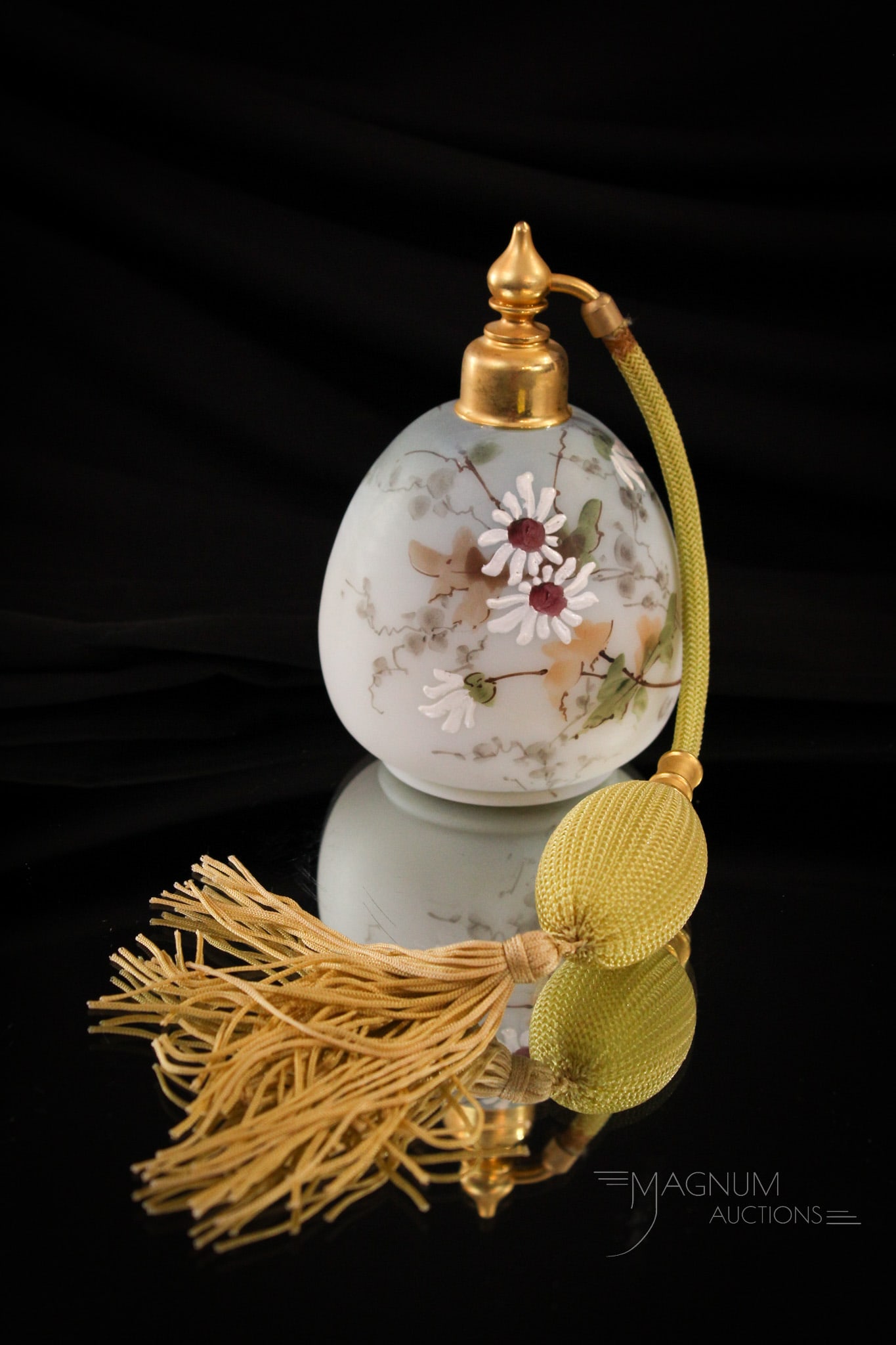 Mt. Washington Victorian Glass Perfume Atomizer: Beautiful blue shading to white with floral decorations of daisies adorn this masterfully decorated perfume atomizer of the Victorian age. Complete with working harware. It measures 5" tall.