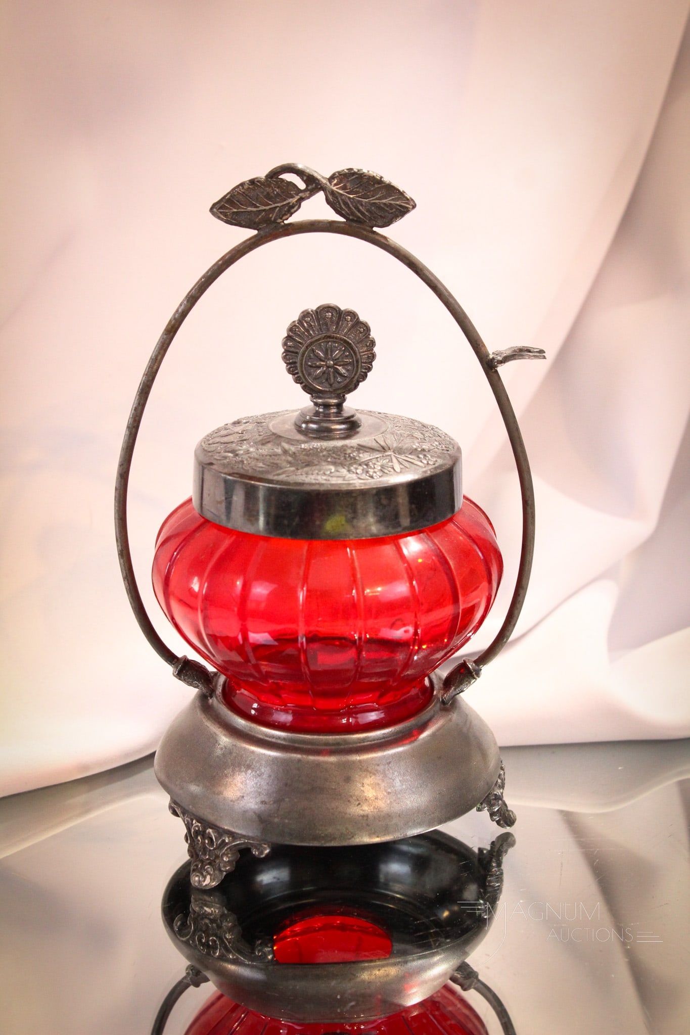 Empire Silverplate Victorian Pigeon Blood Satin Glass Pickle castor: Nice find here in this pigeon blood red satin Torquay pattern pickle jar set in signed Empire silverplate holder. Complete it measures 8" tall.