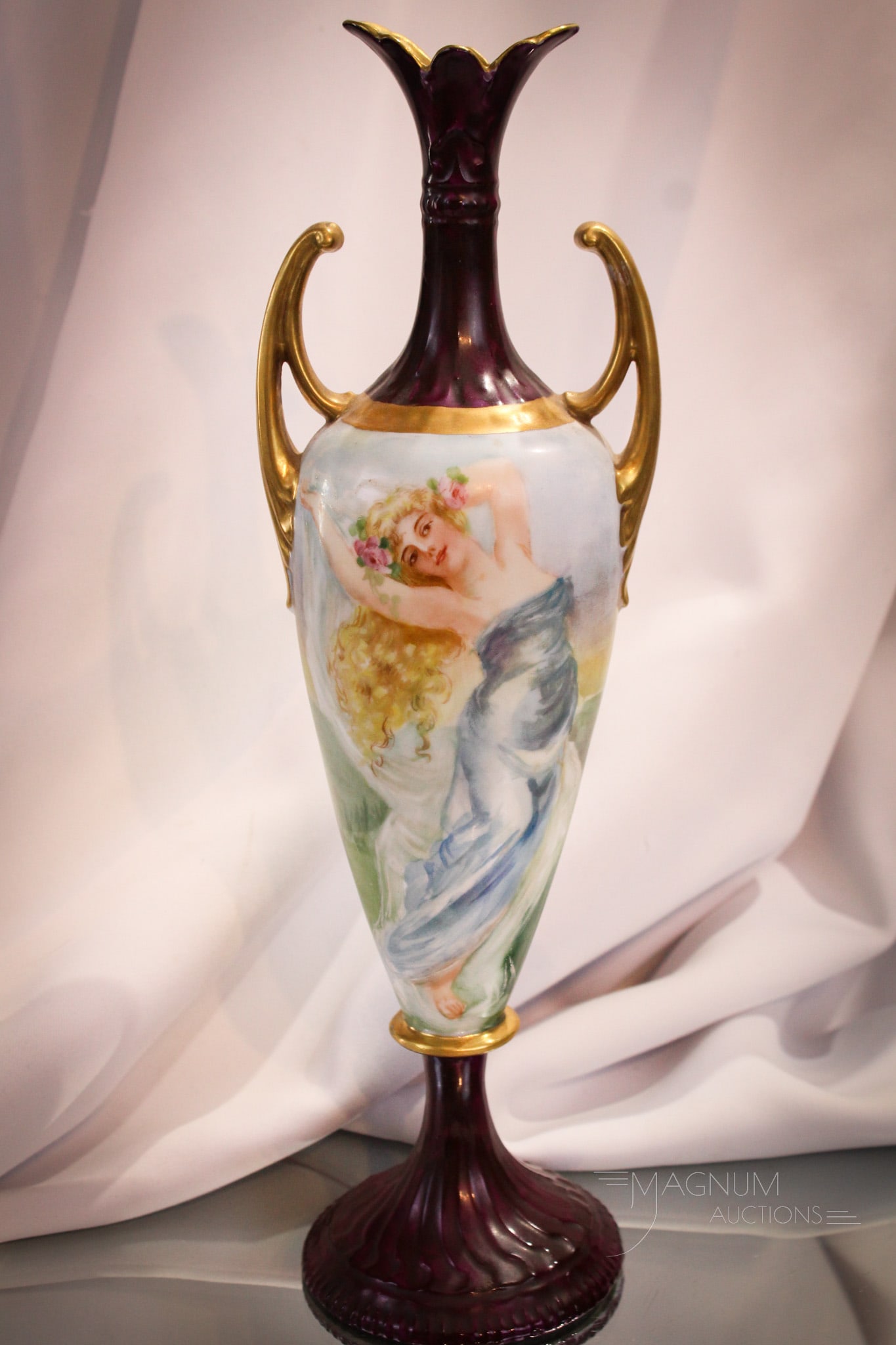 Hand Painted Porcelain Double Handle Vase: Graceful figural design on this Austrian origin vase. Vase features double handles and romantic image. Piece measures 13" tall.