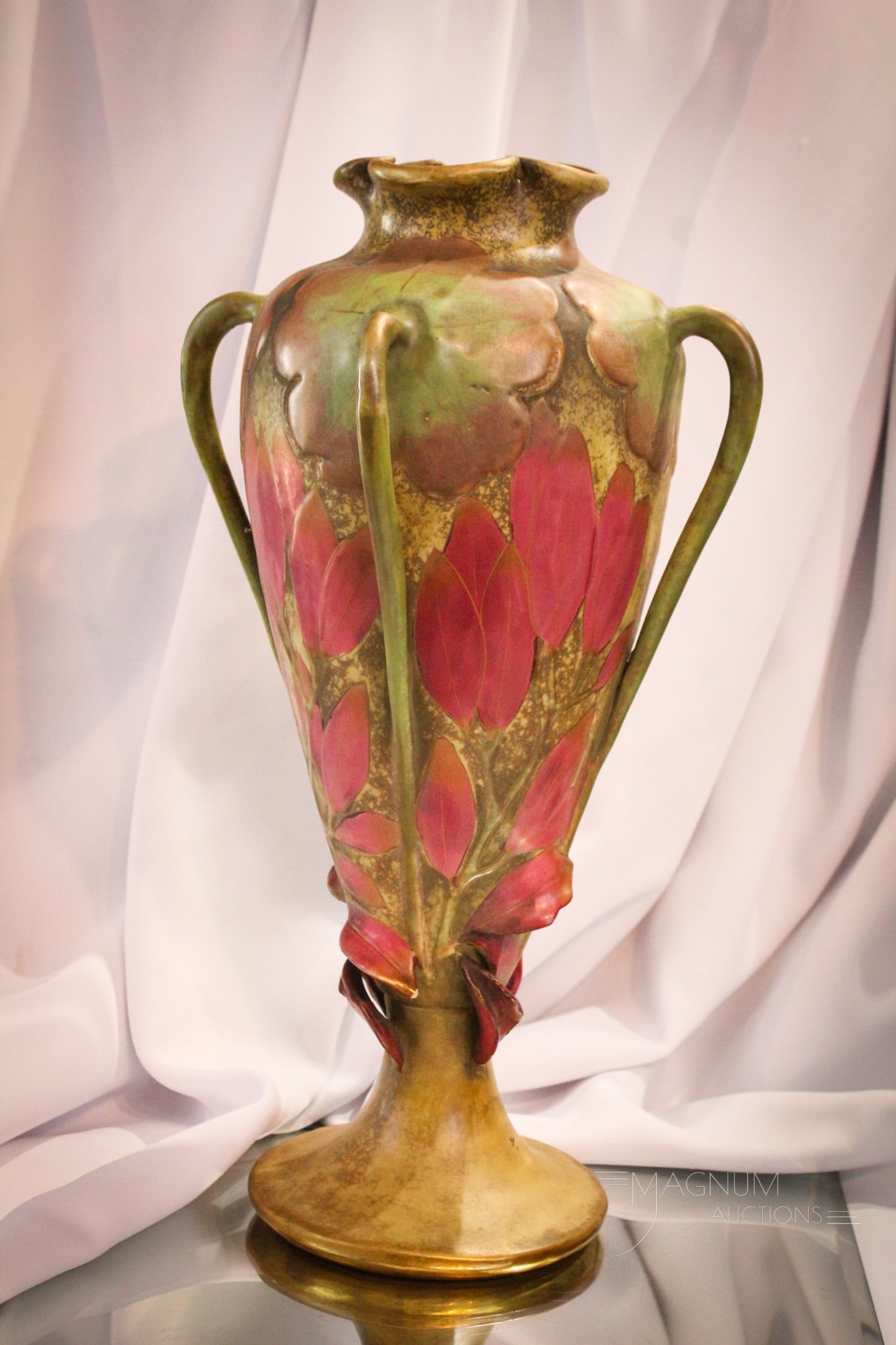 Marked Amphora Art Nouveau 17" Porcelain Vase: Fantastic Art Nouveau Floral motif porcelain vase with four decorative handles and pedestal base. Piece is marked "Amphora". Measures a staggering 17" tall.