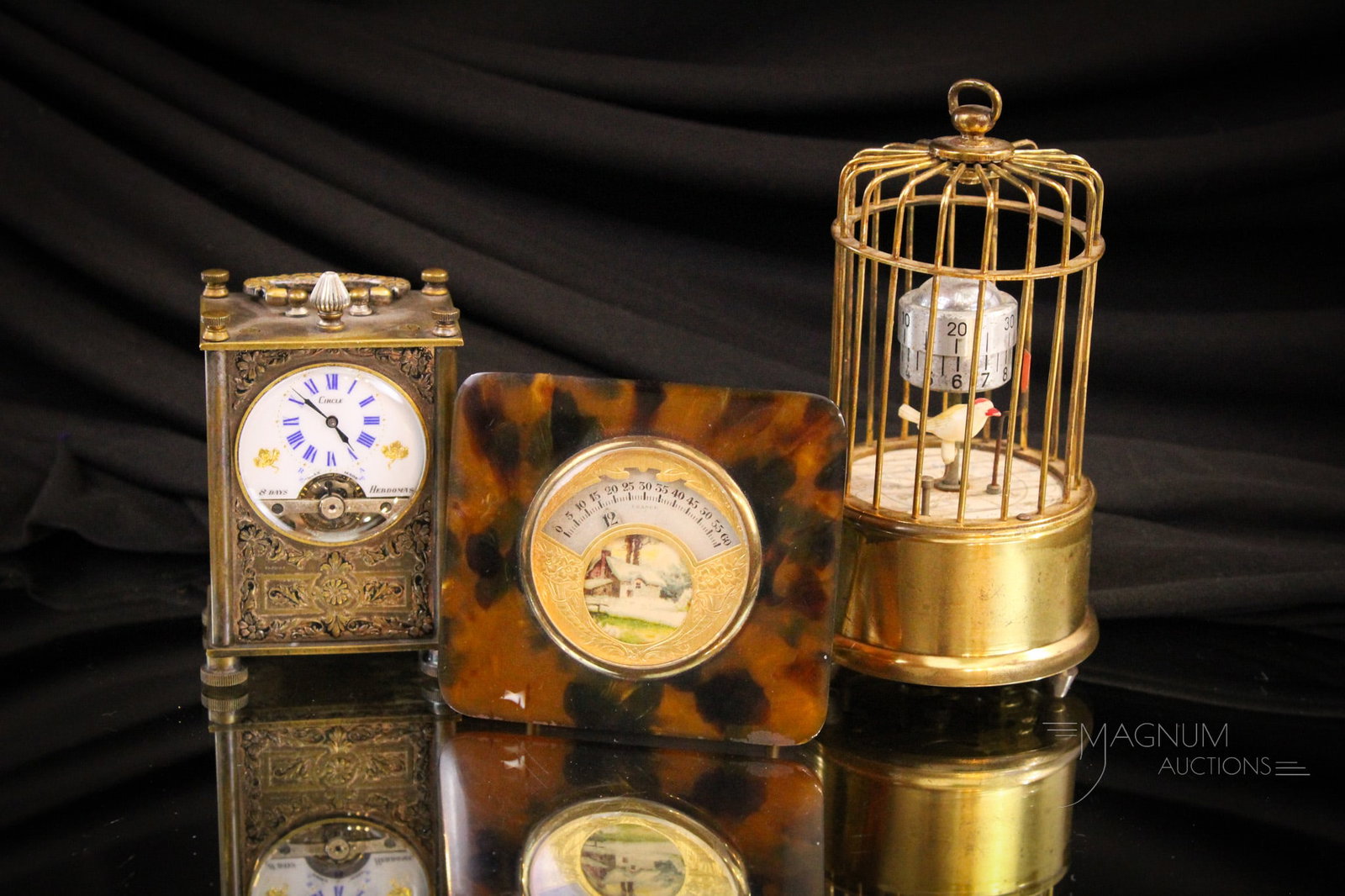 3 pc Lot Antique Clocks Carriage Birdcage French: Three fine examples of collectible antique clocks. The first a Circle watch Co., Swiss made brass carriage clock with decorative panels. Second, Agerman brass mechanical birdcage clock. Finally, a she