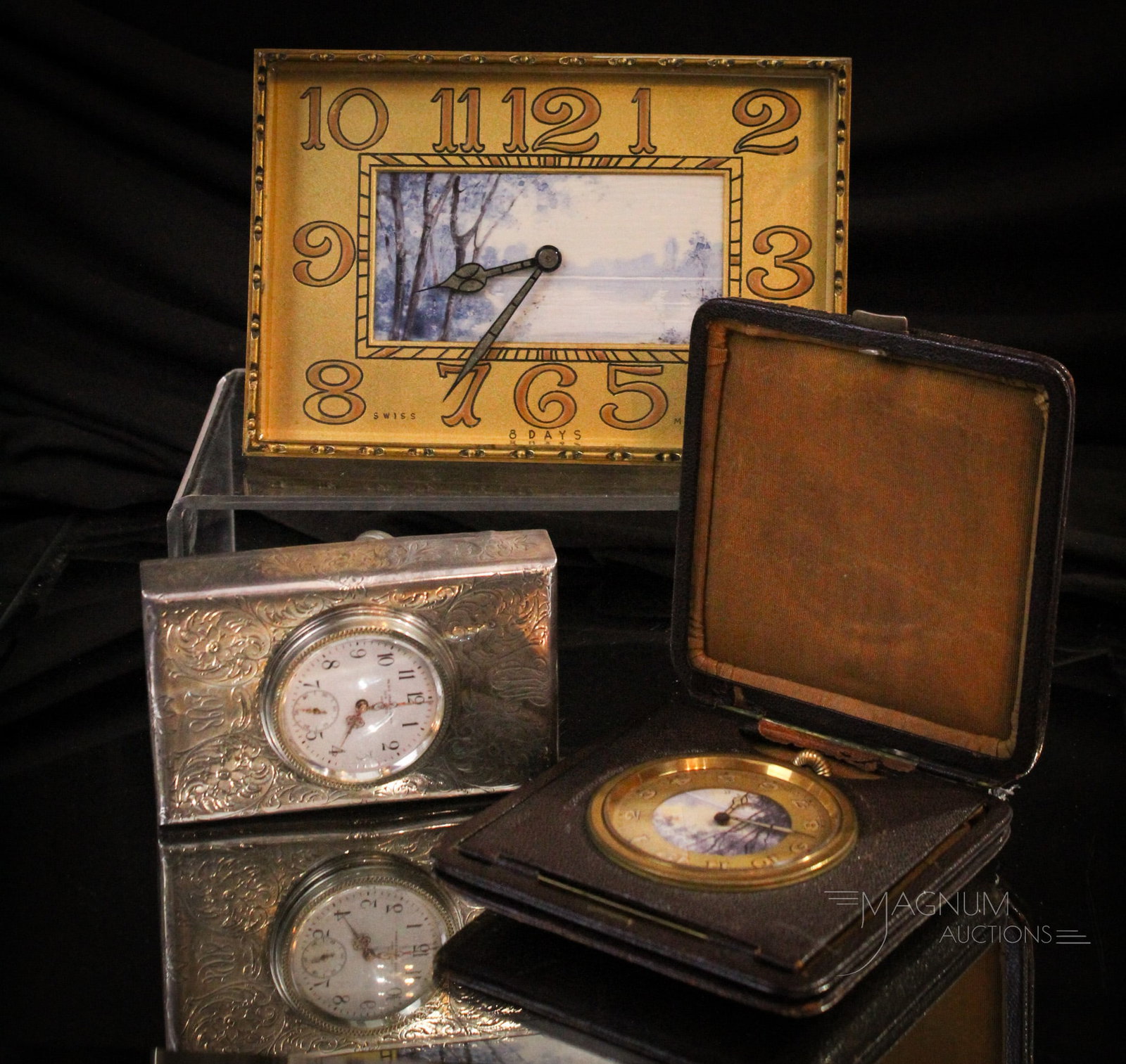 3 pc Lot Collectible Antique Clocks Swiss Sterling & More: Three highly collectible antique clocks. Lot is comprised of a Black, Starr, & Frost sterling desk clock with swiss movement. The second, a Swiss made brass cased clock in leather holder. The third a 