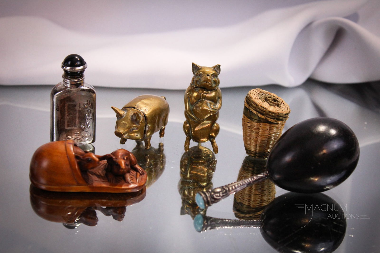 7 pc Lot Thimble Pig Pill Boxes Sterling Perfume Bottle Darner: A seven piece lot of miniature collectibles. Lot is comprised of two miniature figural pig brass pill boxes. A tiny sterling perfum. A thimble in woven basket. A darner with silver and turquoise handl