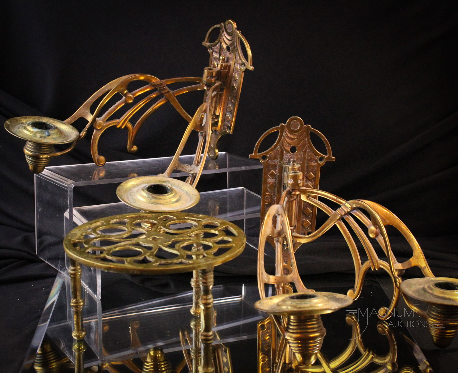 Pair of Antique Art Nouveau Brass Wall Sconces & More: Fine pair of brass Art Nouveau wall candle sconces. Each measures 7" tall, 14" wide. Both of these along with a brass trivet.