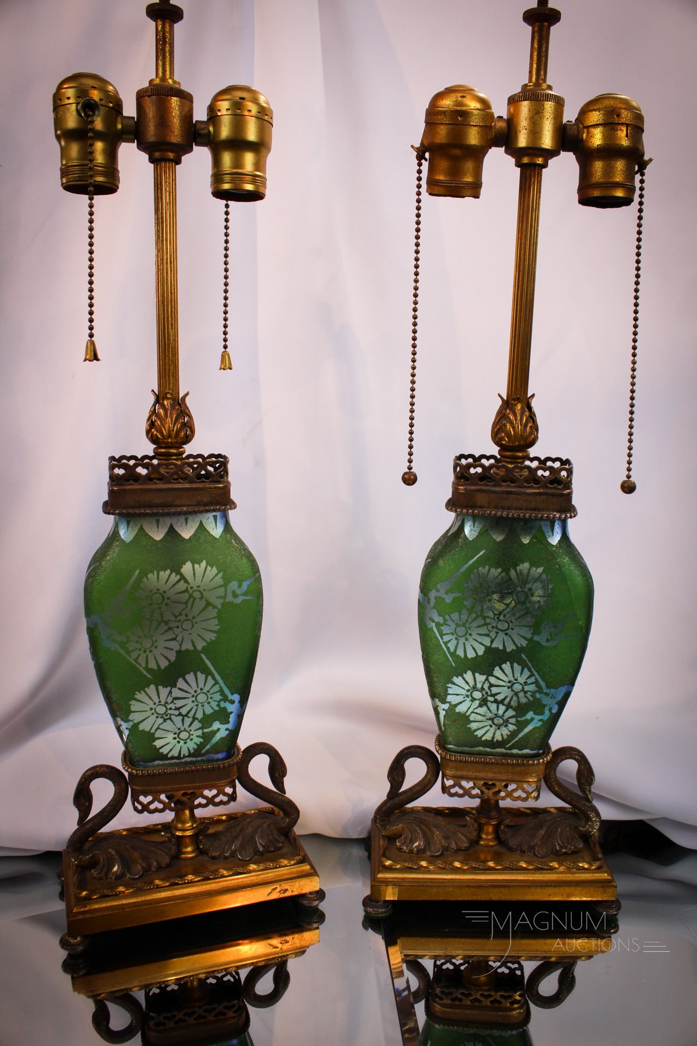 Pair Steuben Acid Cutback Green Jade Blue Aurene Table Lamps: Two beautiful Steuben green jade blue aurene acid cutback table lamps. Lamps come complete with period shades. Mountings feature swans at the base.