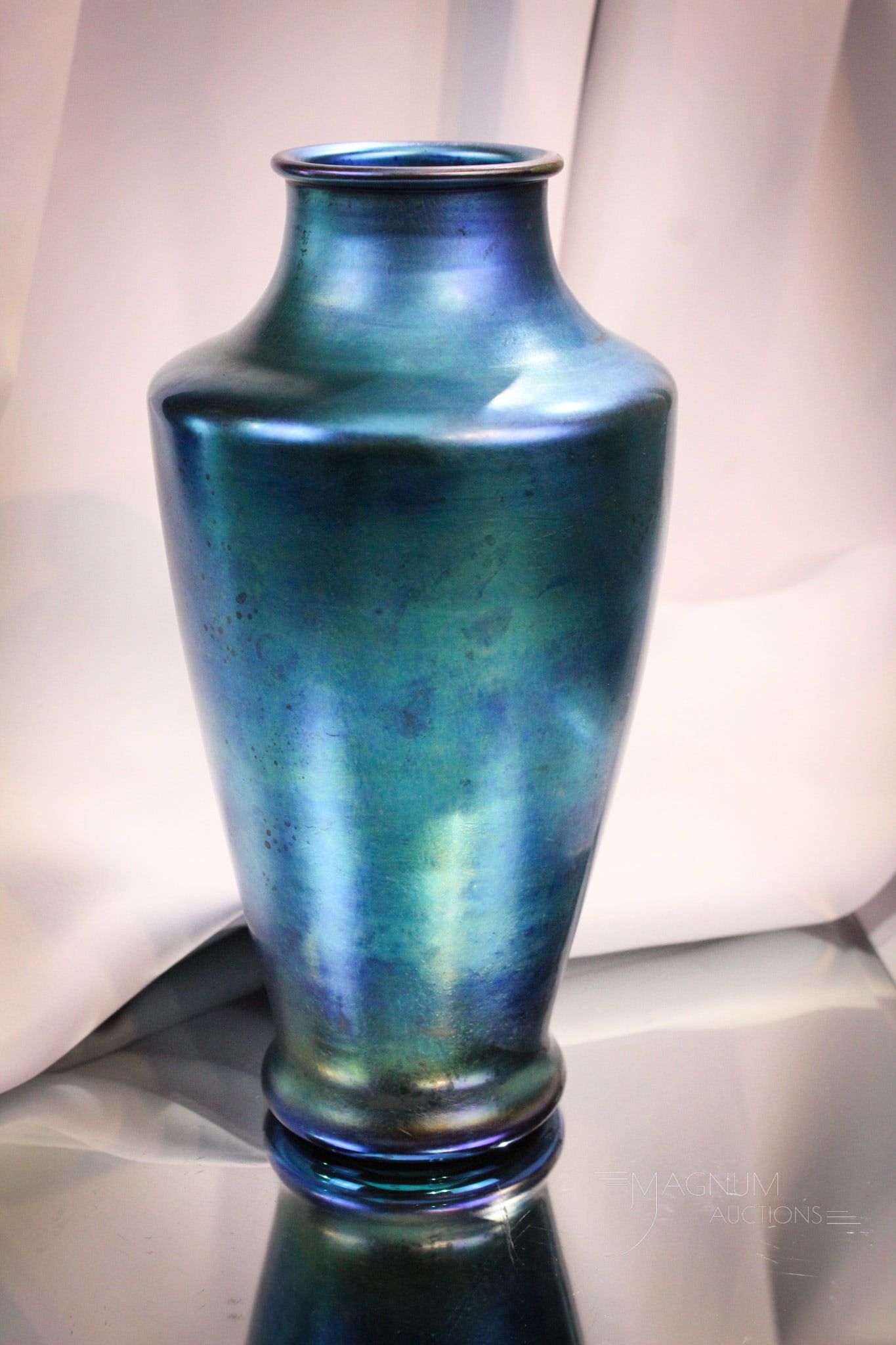 Steuben Blue Aurene #2114 10" Glass Vase: Fantastic Steuben blue aurene vase with brilliant coloring. Marked, "Aurene & 2114". Measures 10" tall.