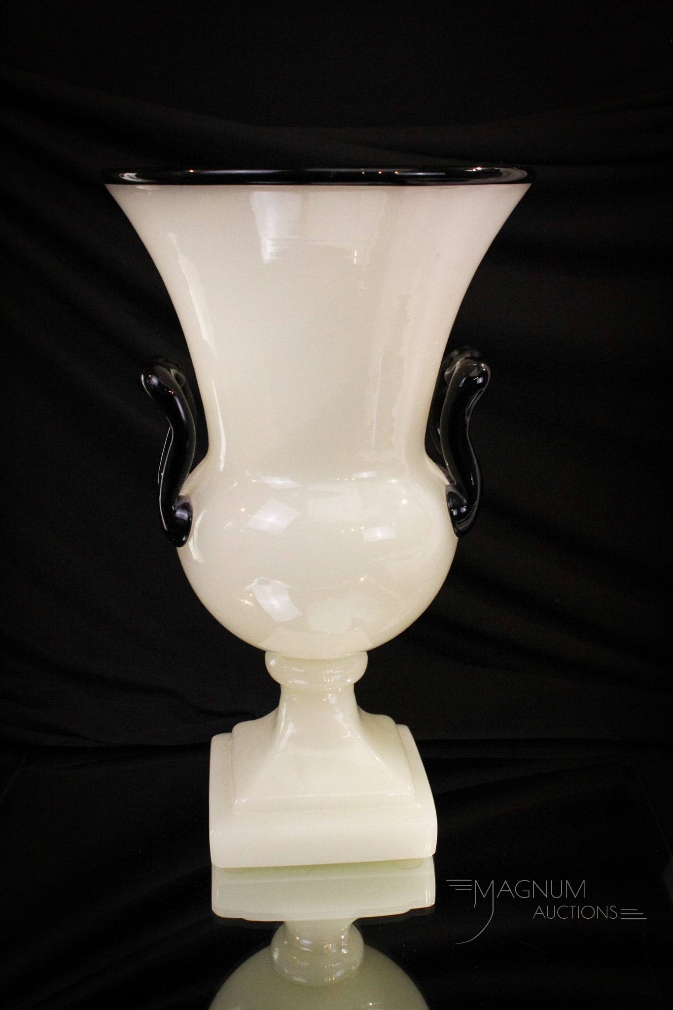Steuben Alabaster Mirror Black Glass Vase: Select offering of a Steuben alabaster with mirror black handles and rim. Numbered, "7468". Measures 12" tall.
