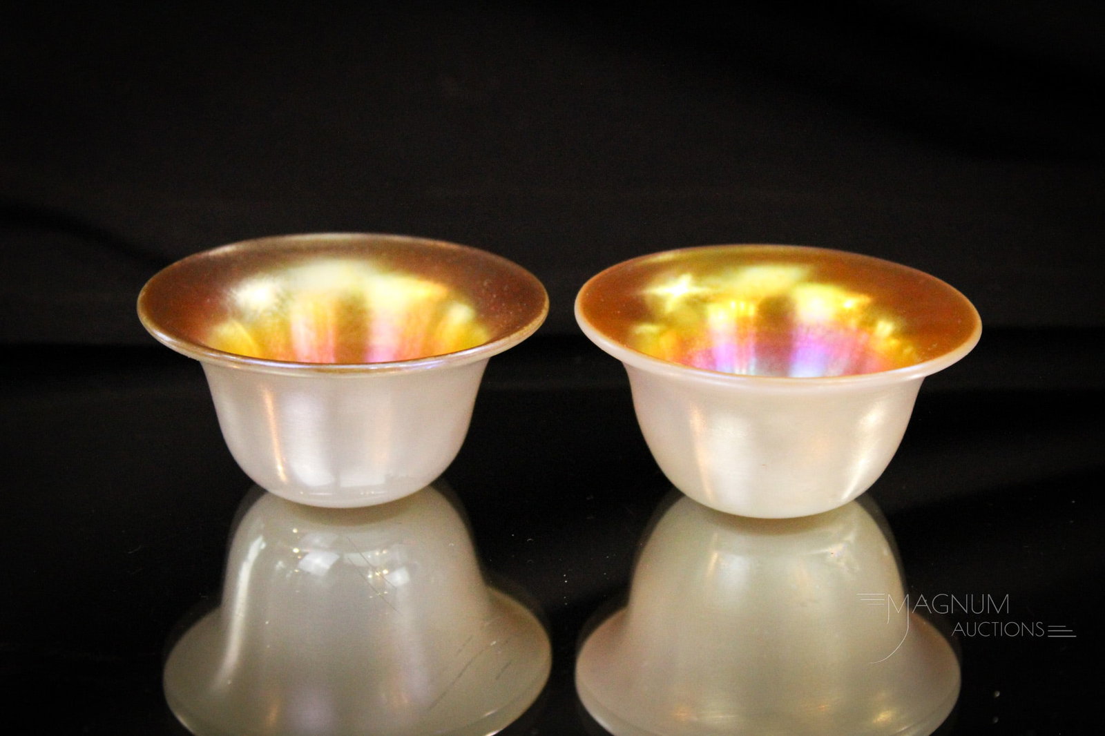 2 pc Lot Steuben Gold Aurene on Calcite Open Salts: Two gems here, folks. A pair of Steuben gold aurene on calcite open salts. Each measures 1 1/4" tall, 2 1/2" diameter.