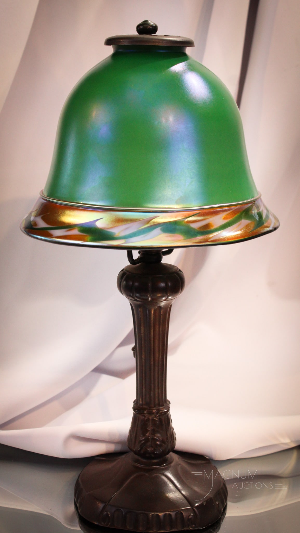 Steuben Intarsia Green Aurene Lamp: Vivid and brilliant Steuben Intarsia green aurene table lamp complete with base. The shade is phenomenal with bold coloring and brilliant irridescence. Base complete with Hubbell socket. Measures 14 1
